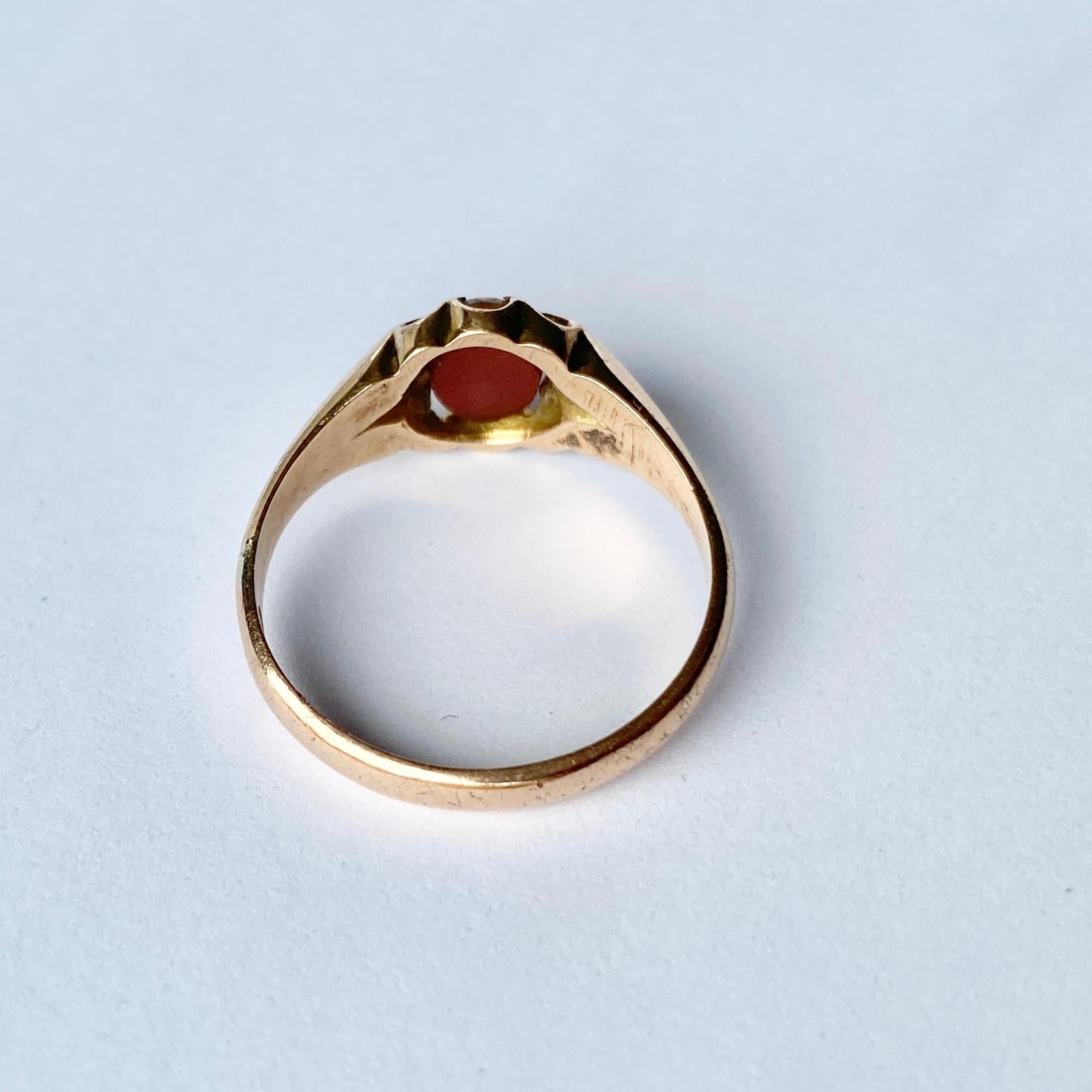 Sat upon simple ridged shoulders is a gorgeous sardonyx stone with a deep burnt orange underside and a pale white coating to the top. Fully hallmarked Chester 1915.

Ring Size: P or 7 3/4 
Stone Dimensions: 6x5mm 

Weight: 2.9g