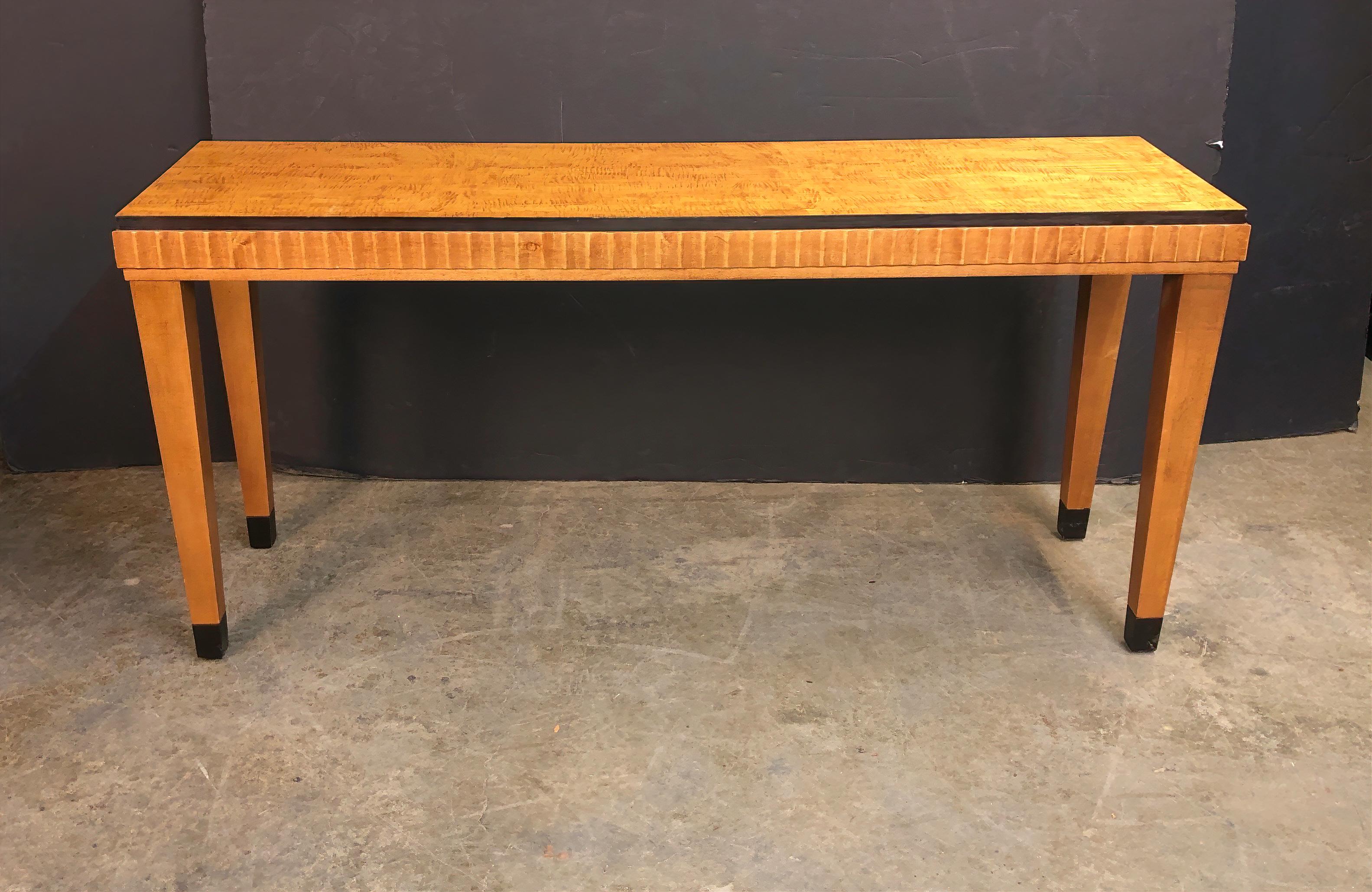 Art Deco satinwood console table with ebonized banded and square tapered legs.