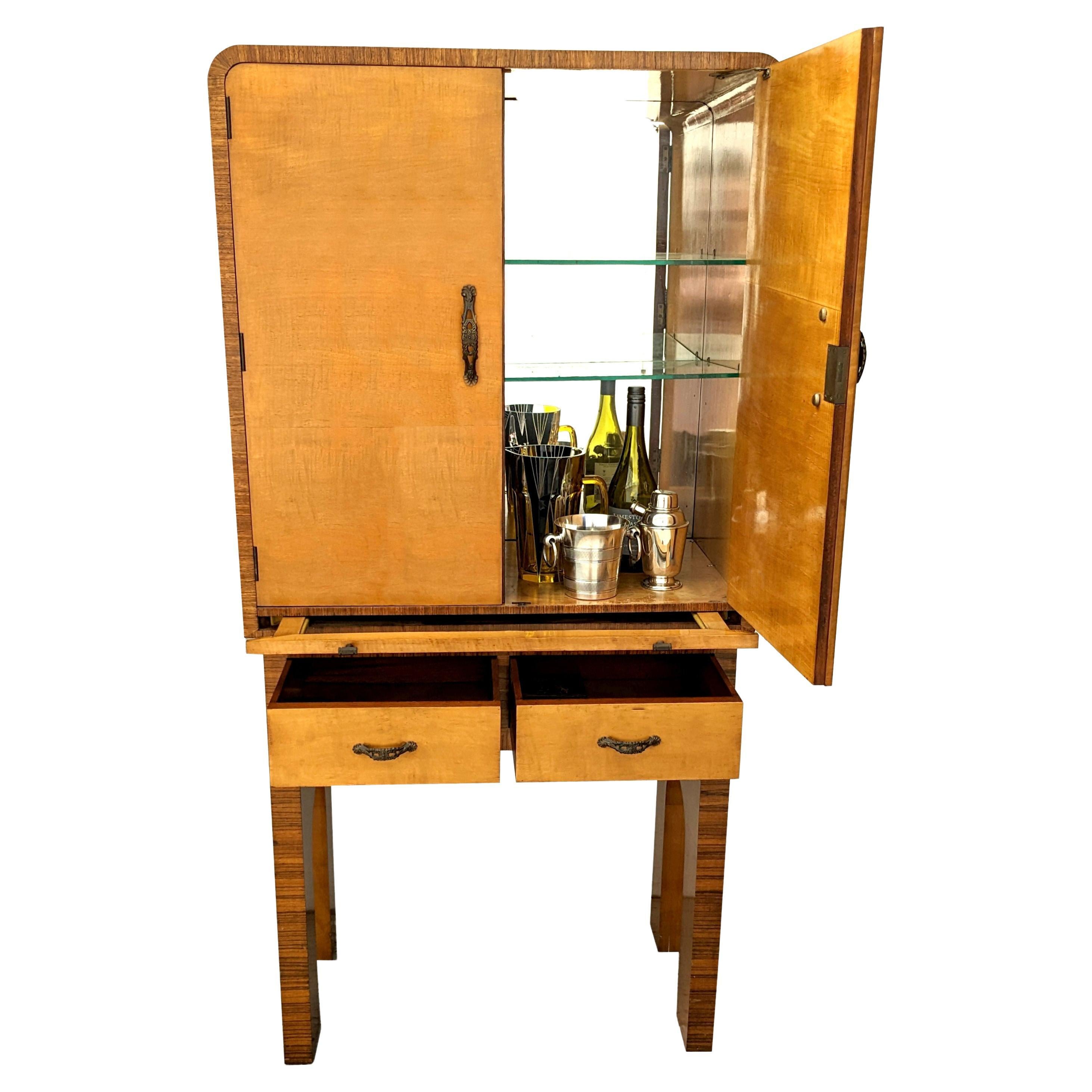 For your consideration is this high end modernist Art Deco Cocktail Cabinet by Harry and Lou Epstein. Dating to the 1930's this cabinet certainly would not have been in your average home. Most of Epstein's furniture were custom made using only the