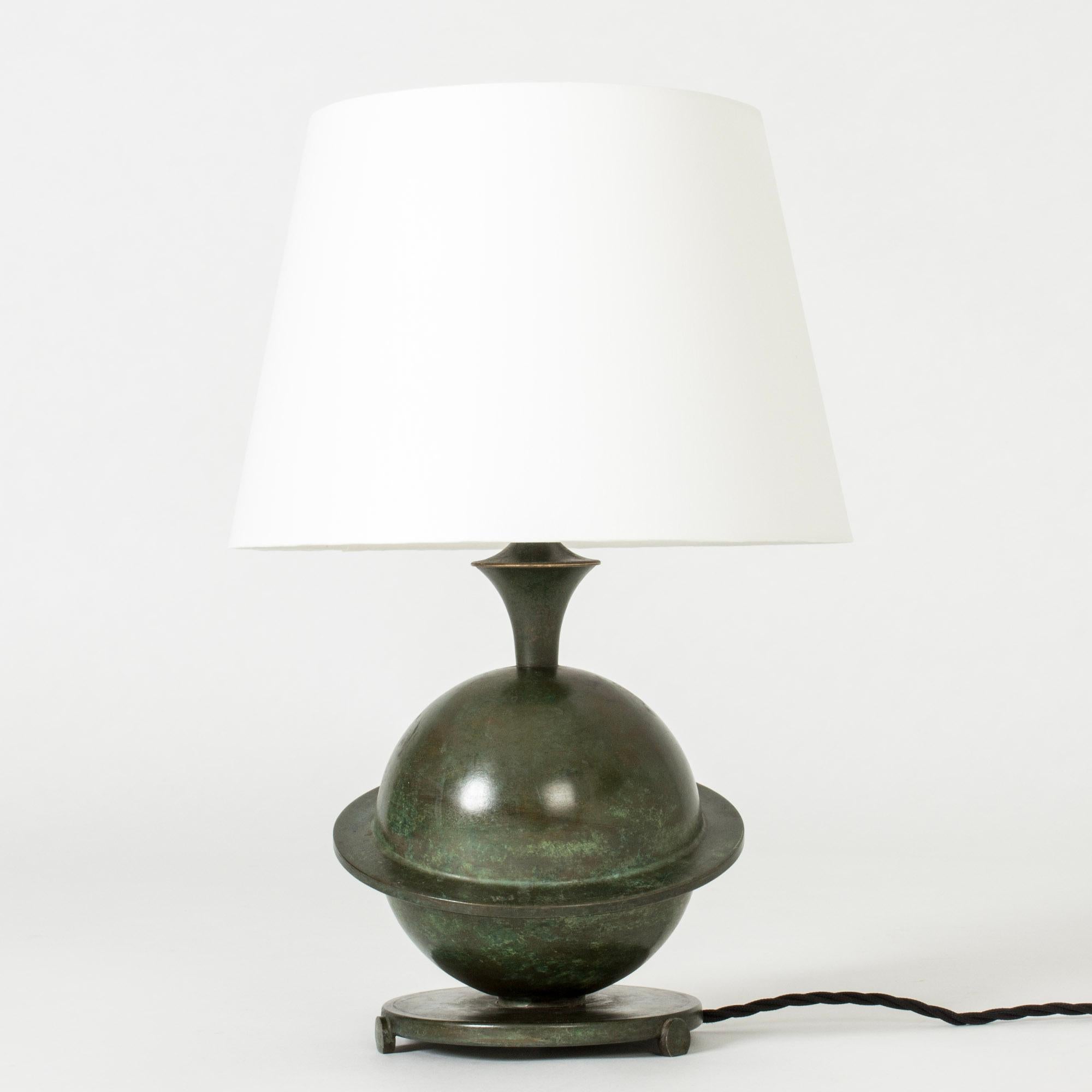 Lovely Art Deco table lamp, made from bronze. Very decorative design with the base in the form of Saturn. Nice patina.