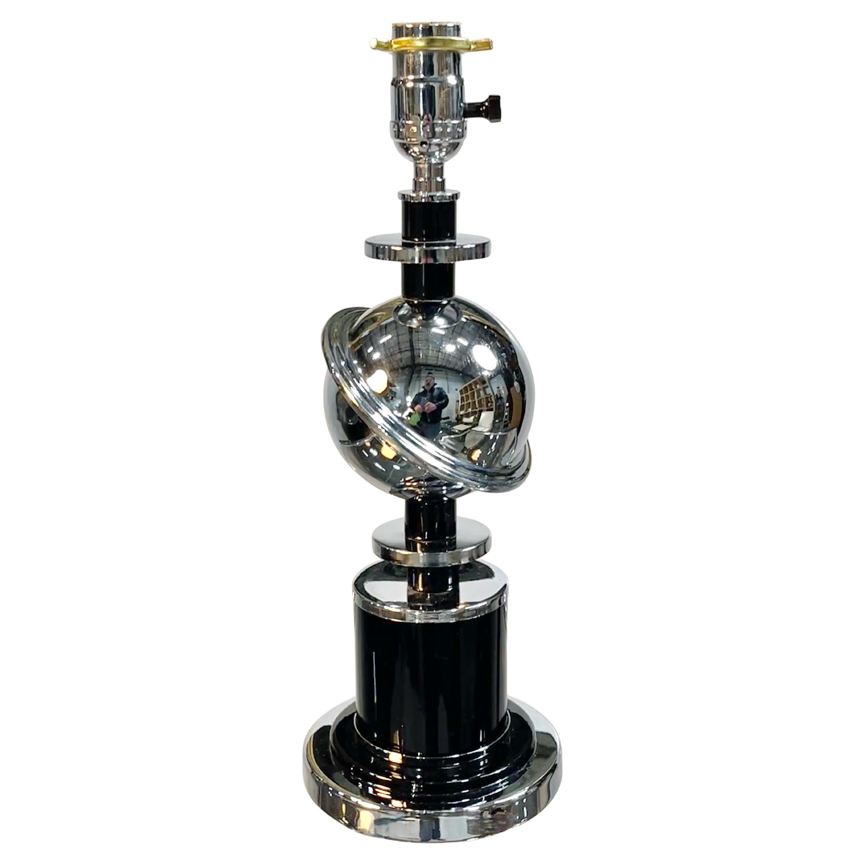 American art deco chrome and black enamel ringed Saturn desk lamp.
Shown with a 7.75