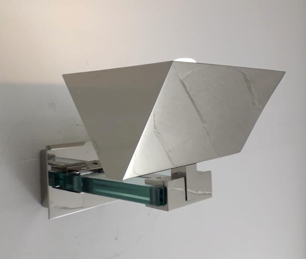 Vintage original Italian wall lights with large geometric chrome shades and back plates mounted with thick beveled glass arms, designed by Fratelli Martini, made in Italy, circa 1970s
1 light / E14 type / max 40W
Measures: Height 7 inches, width 8.5