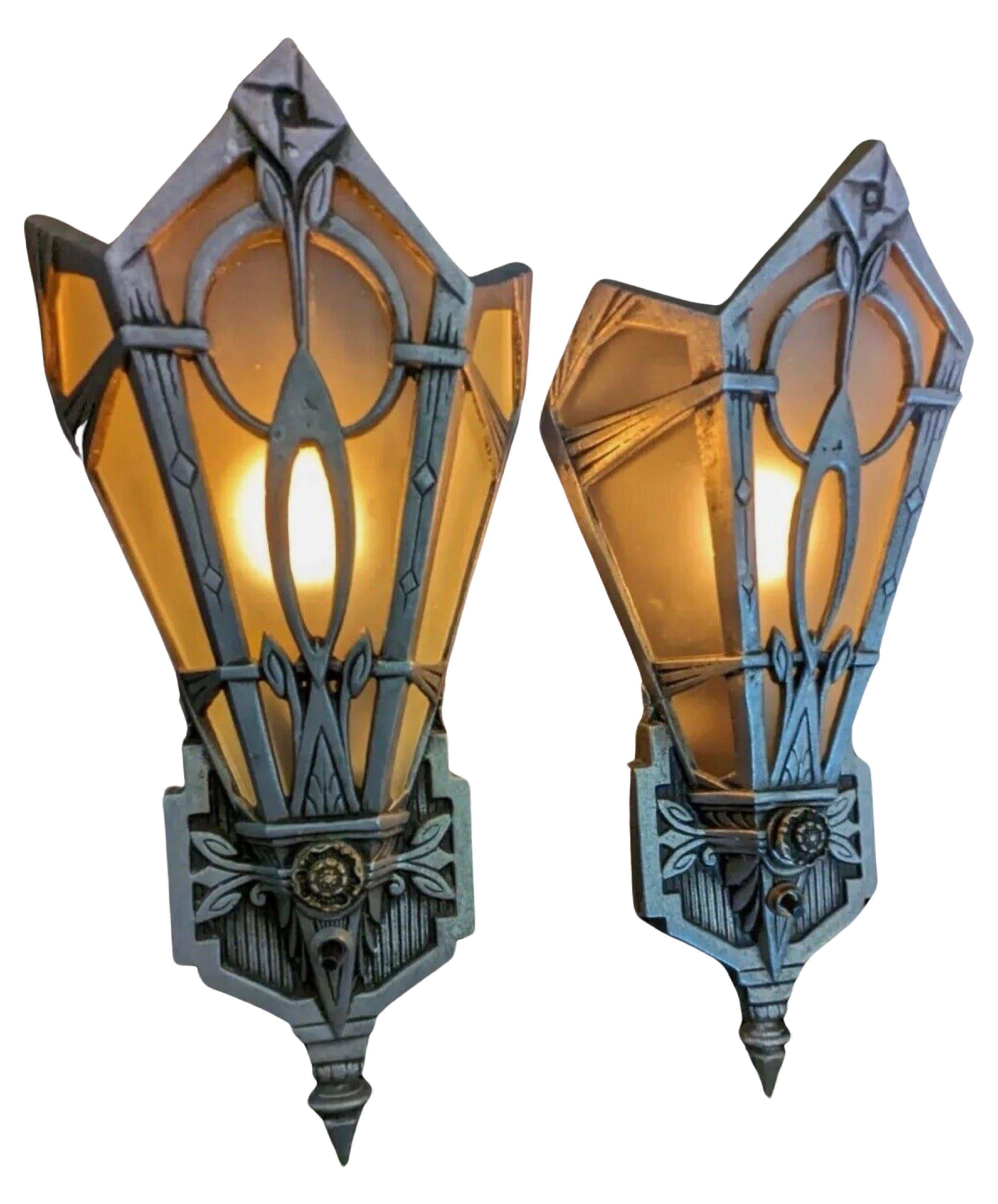 These original 1920′s aluminum Art Deco sconces boast unique design features characterized by symmetry and geometry. Salvaged from a historic theater in Detroit, these sconces are larger than typical ones but suitable for use in a home or office
