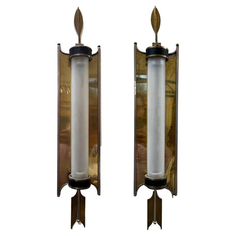Unique pair of art deco sconces, long narrow design with a stunning art deco design. These are period and show the age, see photos. They are extremely rare and collectible as well as functional. Sleek, stylish and beautiful, would set any room apart