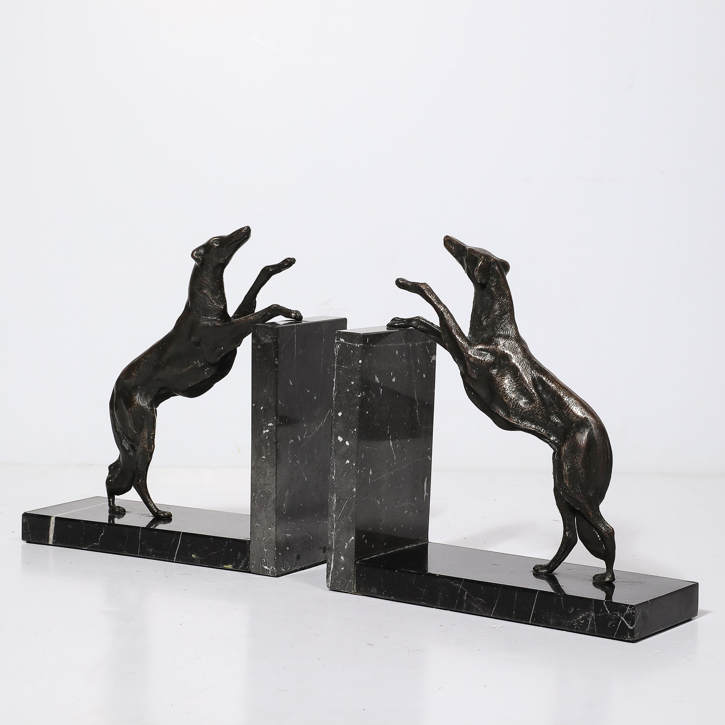 Presenting a captivating pair of Art Deco Sculptural Bronze Greyhound Bookends, dating back to circa 1930 from France. These stunning bookends perfectly capture the sleek elegance and dynamic spirit of the Art Deco period. Each piece features a