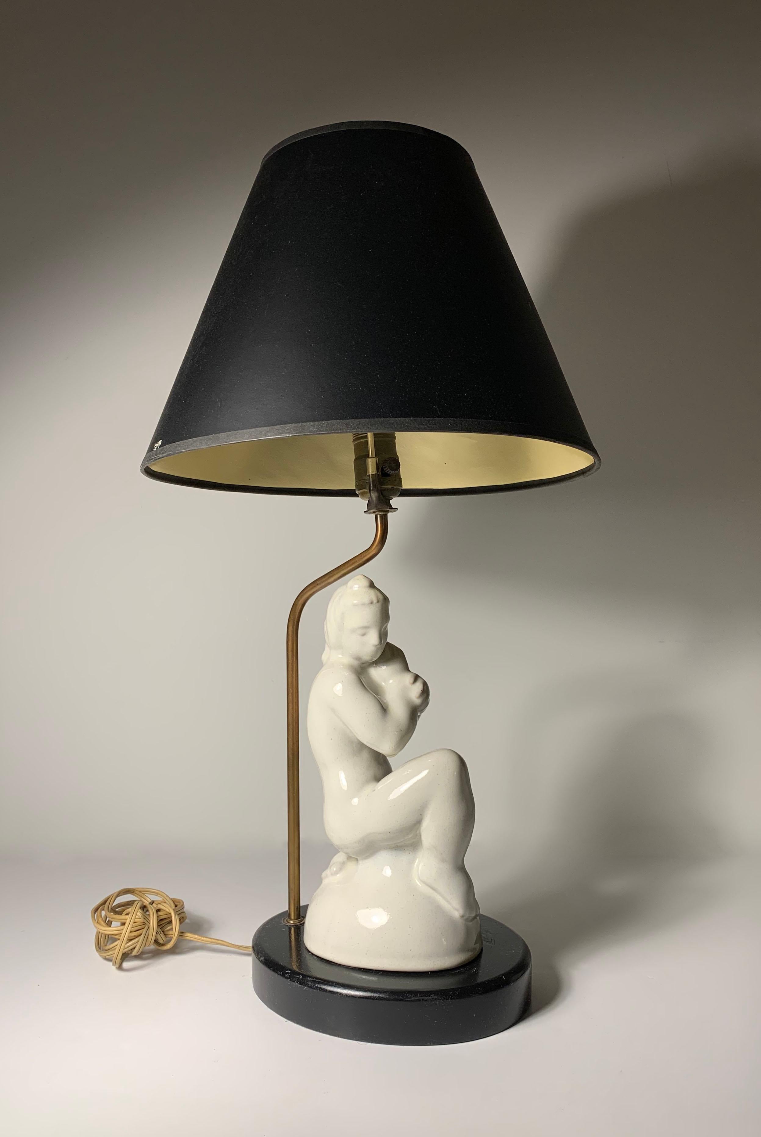 Interesting sculptural pottery table lamp. The ceramic free standing with a clip to hold it in place. So, can also remove the lamp parts and have just the sculpture. Uncertain as to the origin and period. Looks to be European from the 1940s/50s or