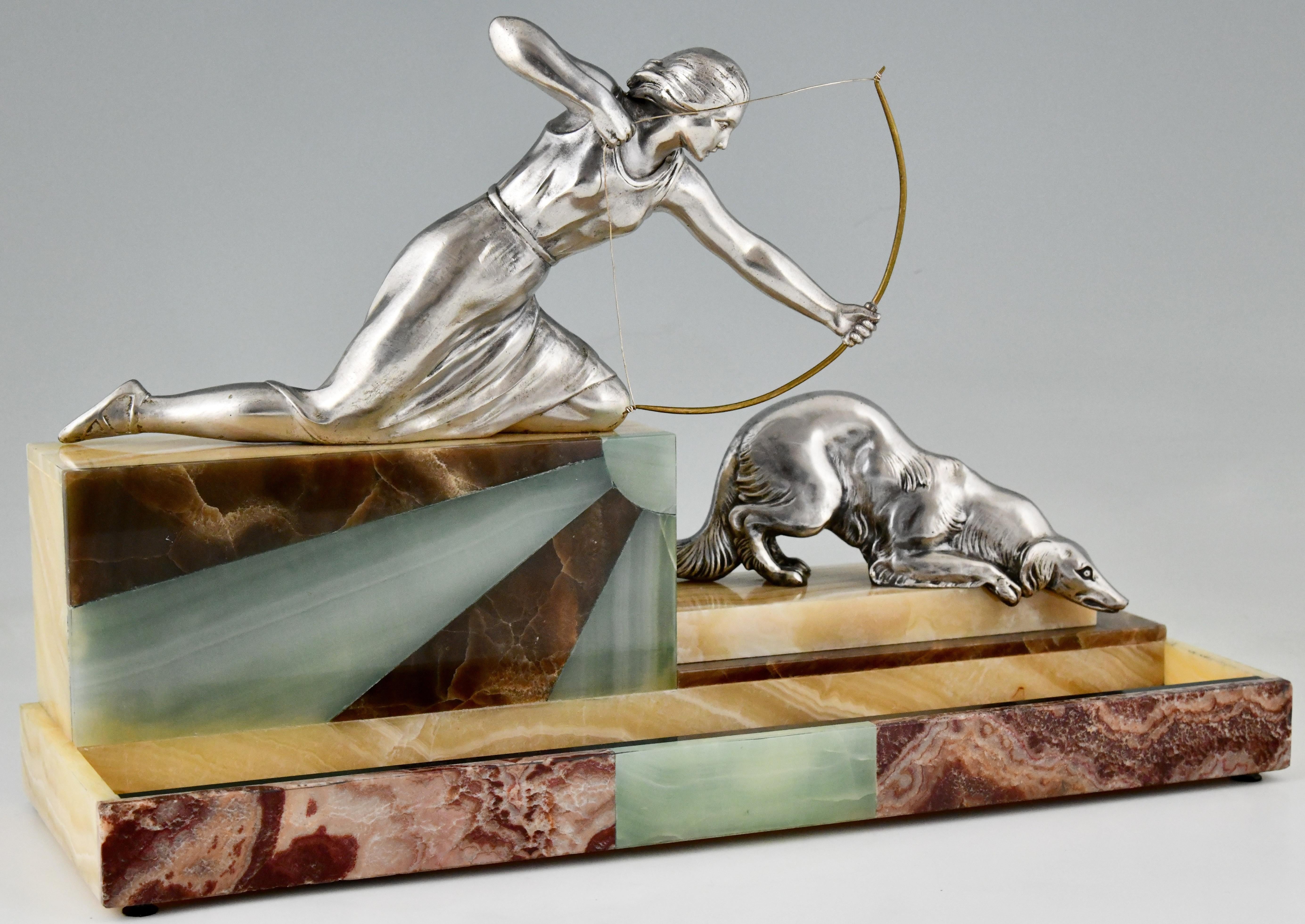 Art Deco sculptural tray Diana the huntress with greyhound dog. 
Signed Leclerc. Impressive size, sculptures in white metal with silver patina on marble base and sunburst onyx inlay. 
France 1930.