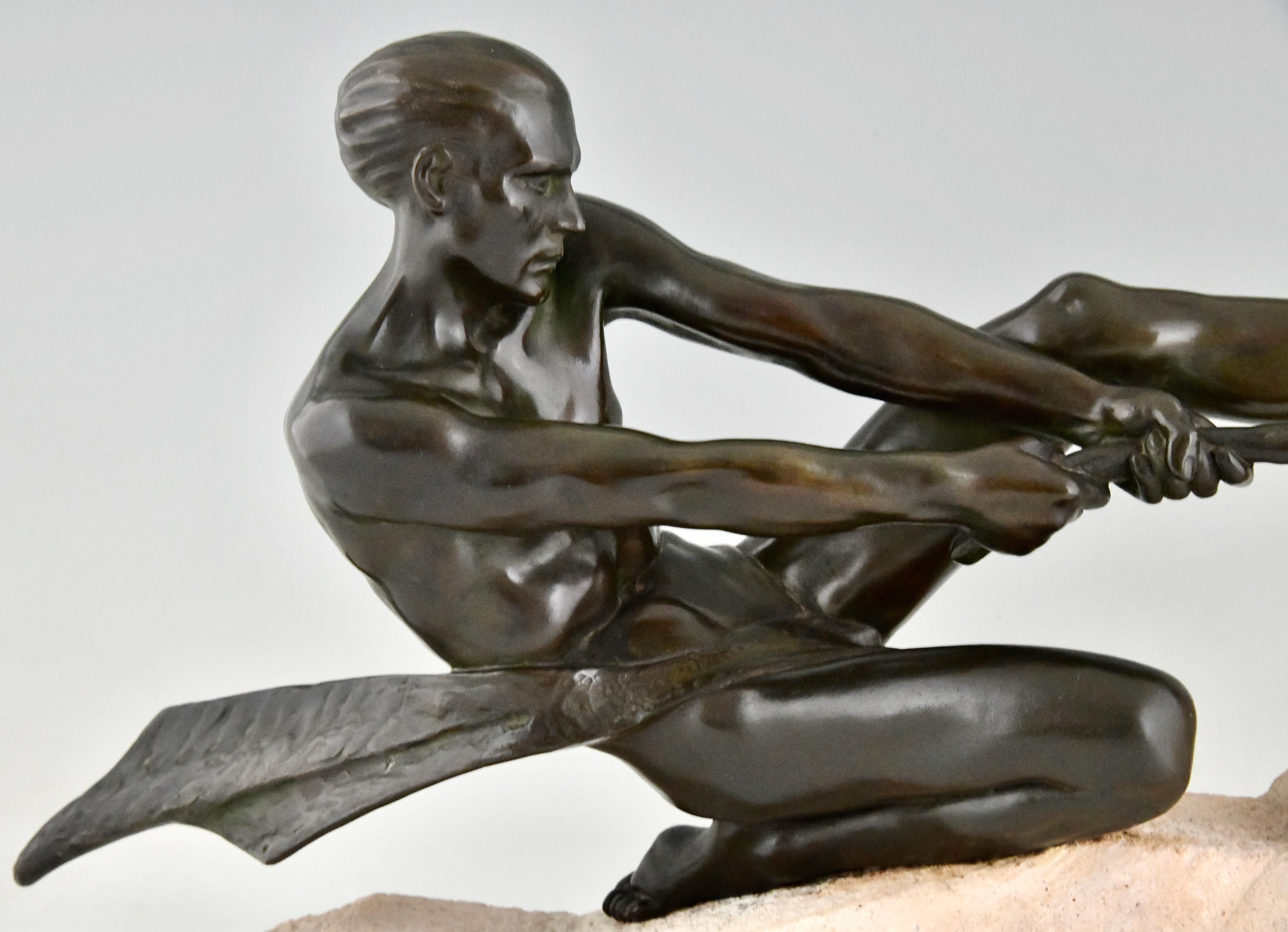 Metal Art Deco sculpture athlete with rope by Max Le Verrier on stone base France 1930 For Sale