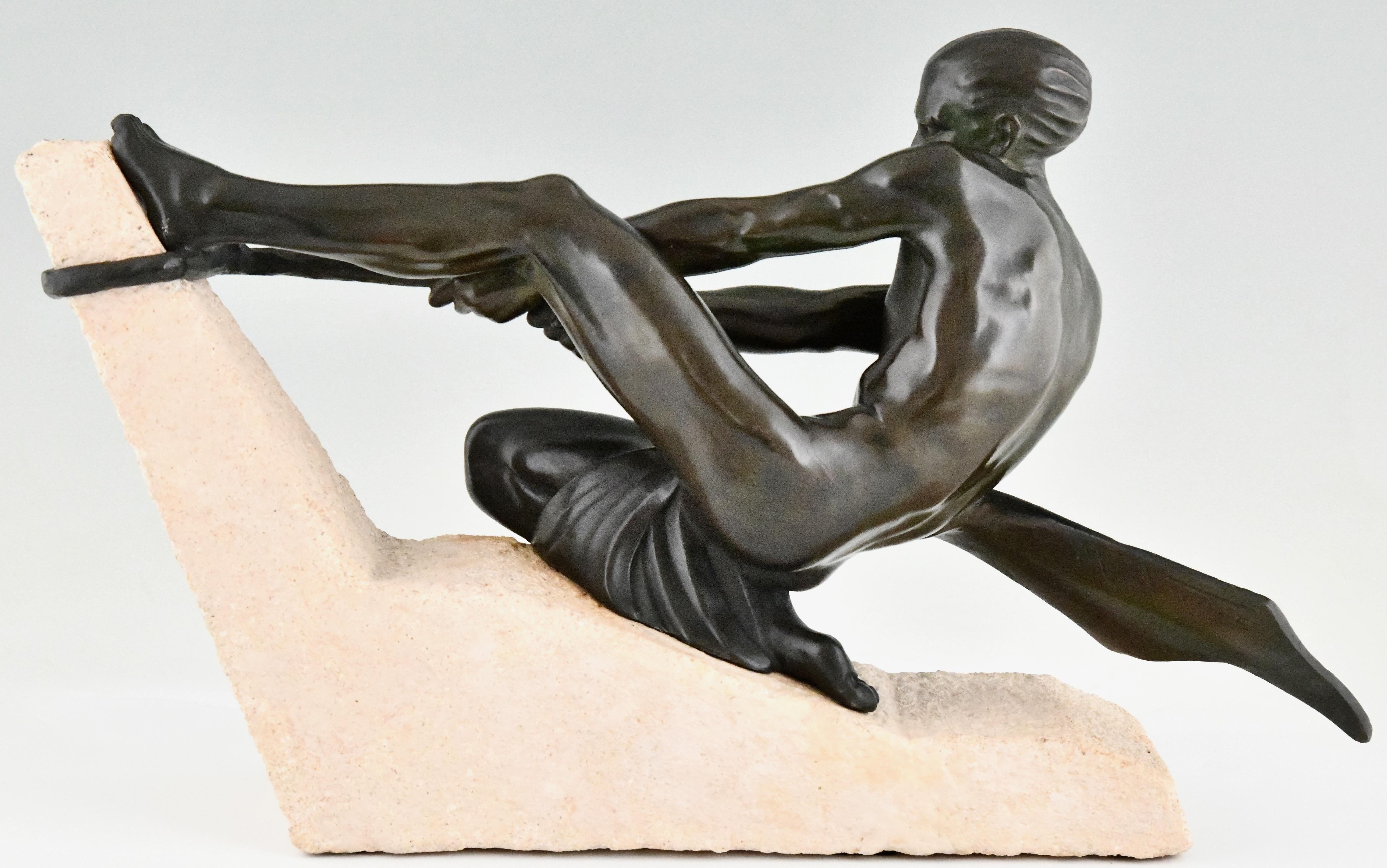 French Art Deco sculpture athlete with rope by Max Le Verrier on stone base France 1930 For Sale