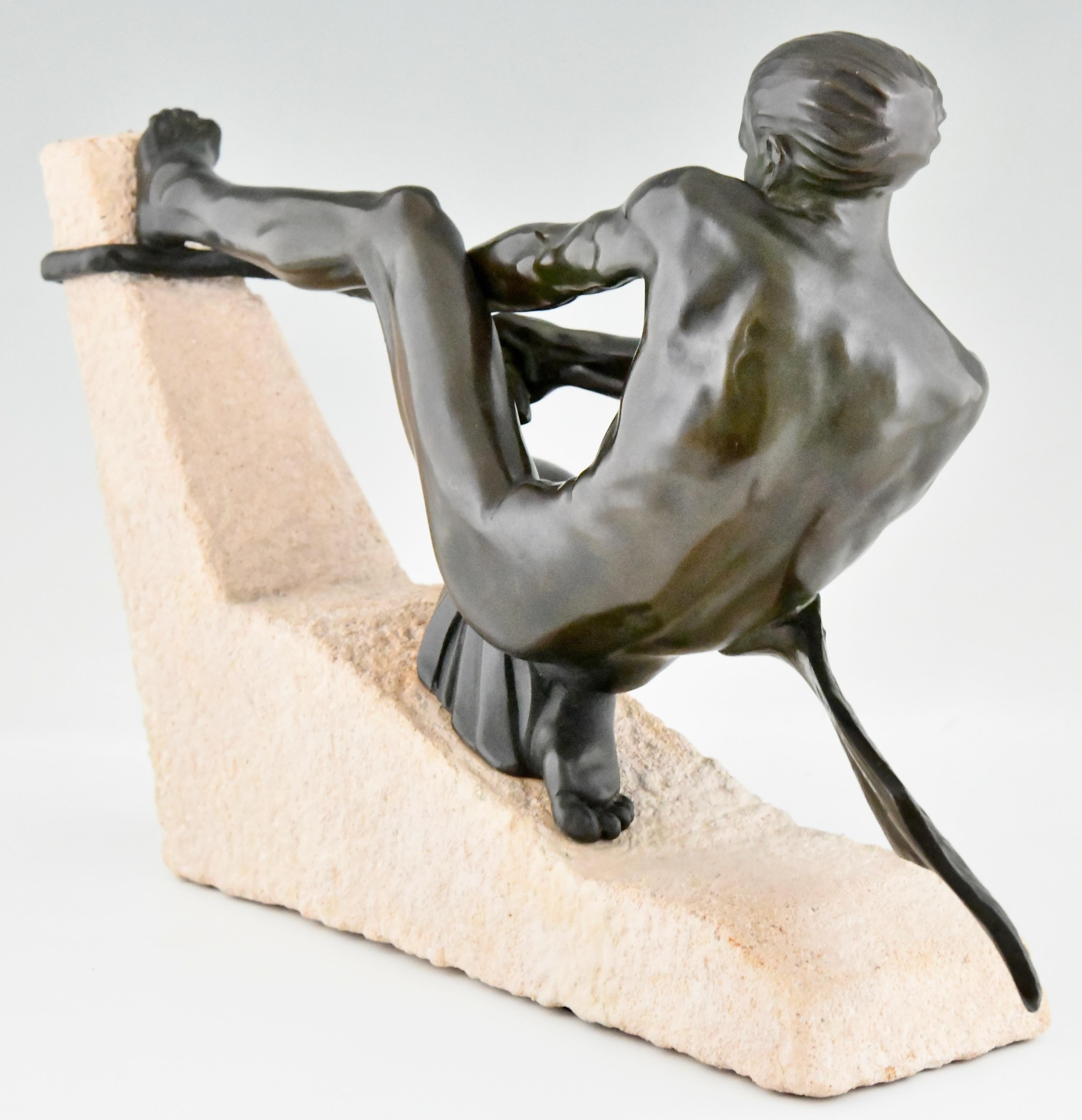 Patinated Art Deco sculpture athlete with rope by Max Le Verrier on stone base France 1930 For Sale