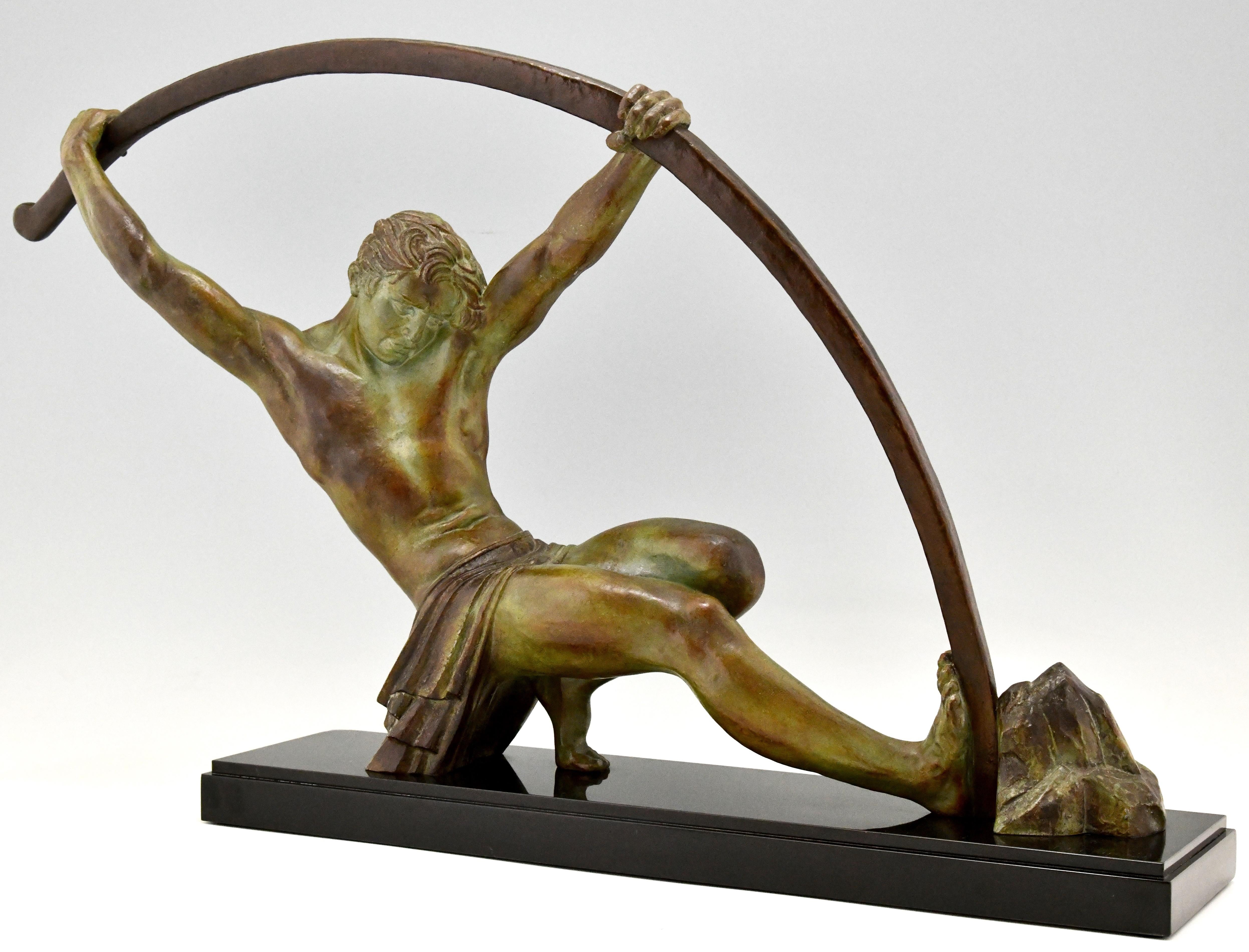 Impressive Art Deco sculpture of an athletic man bending a bar.
This work is titled 