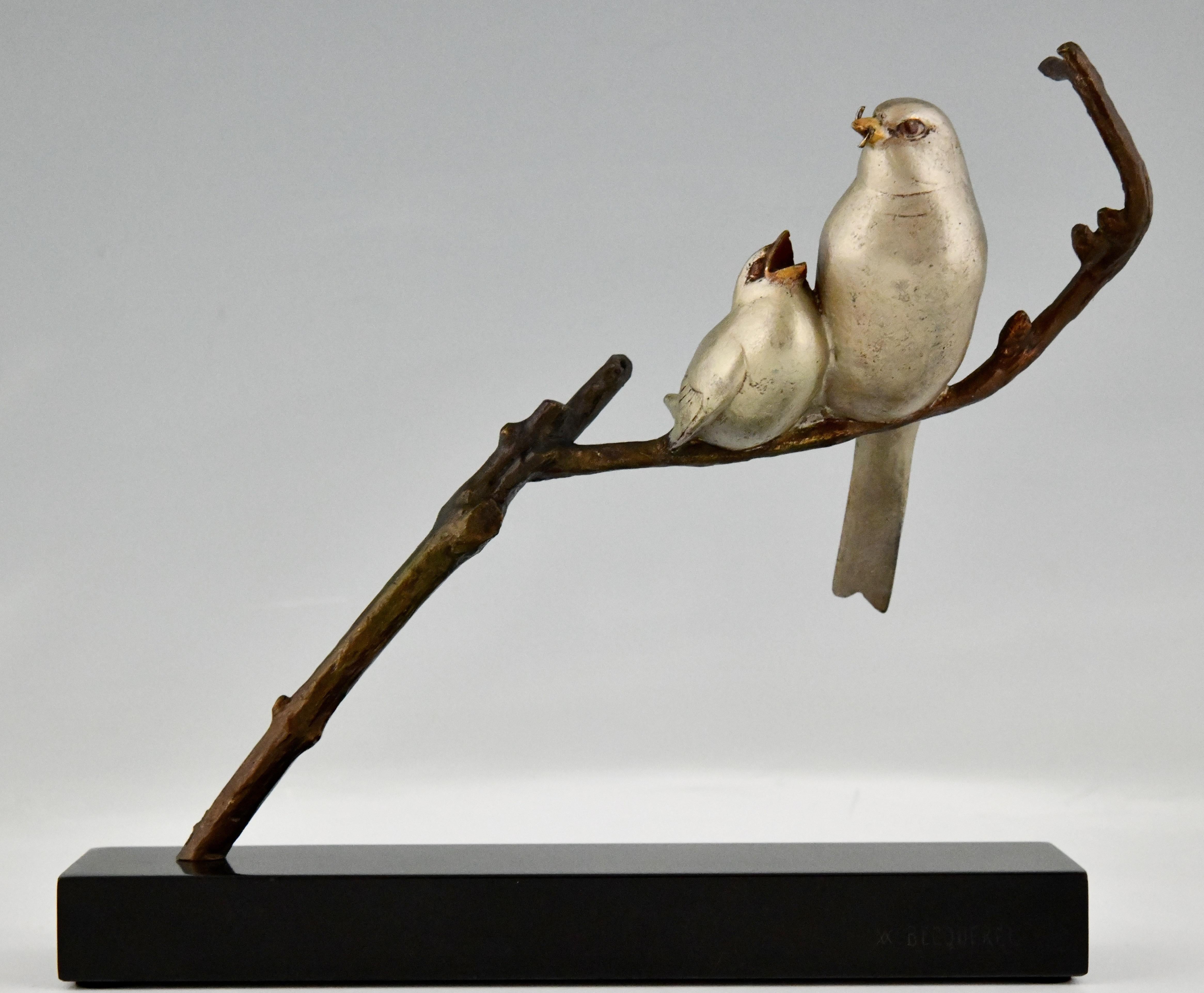 Art Deco sculpture birds on a branch signed by André Vincent Becquerel.
Bronze with silver patina mounted on a Belgian Black marble base.
France 1930. 
Literature:
Art Deco and other figures, Brian Catley, Antique collectors club.
Animals in