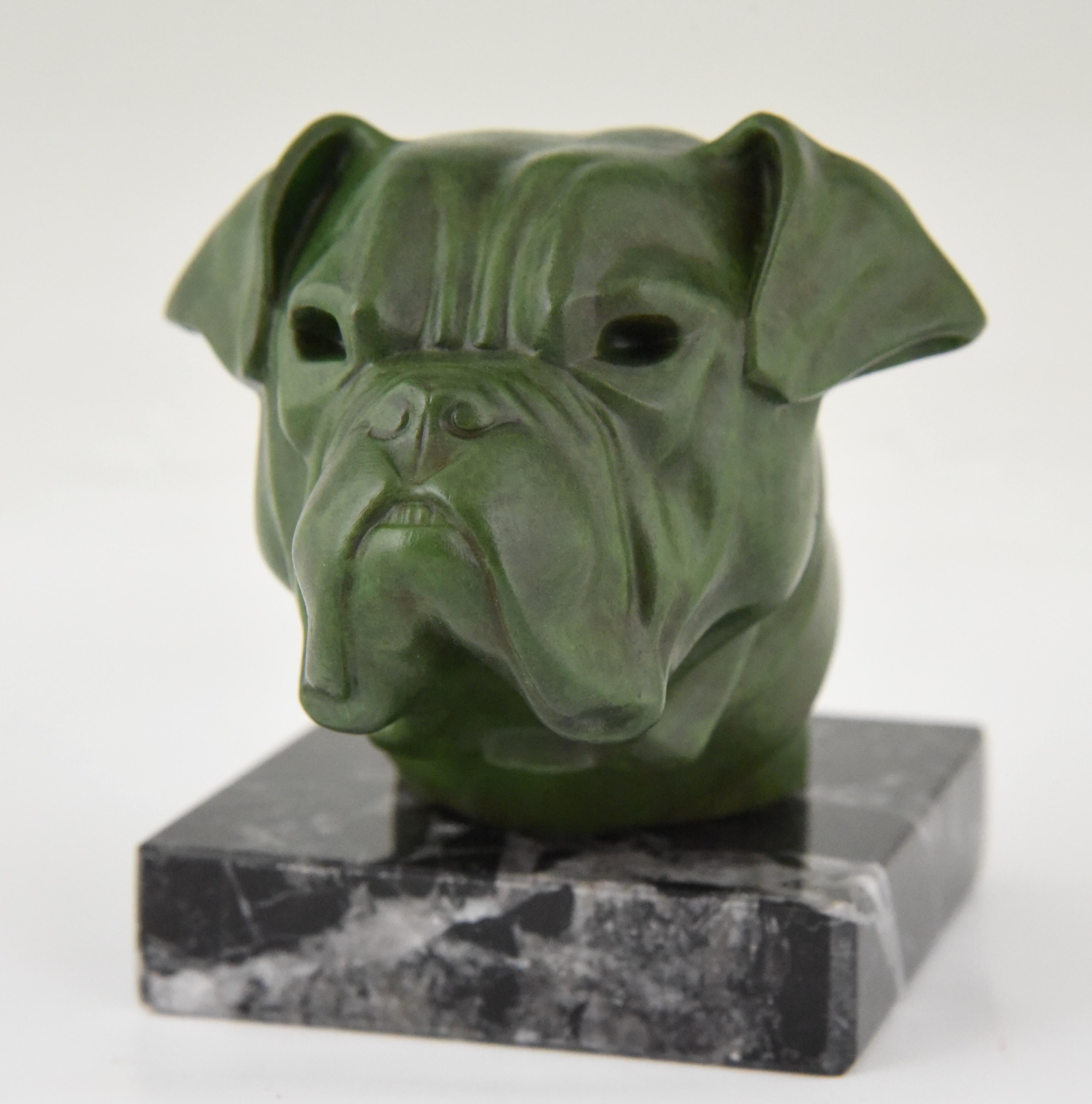 Art Deco sculpture of a bulldog by Max Le Verrier, France, 1930.
Patinated art metal on a marble base. 

This model is illustrated as car mascot in the book: “Mascottes passion” by Michel Legrand, Antic show éditions. General information about