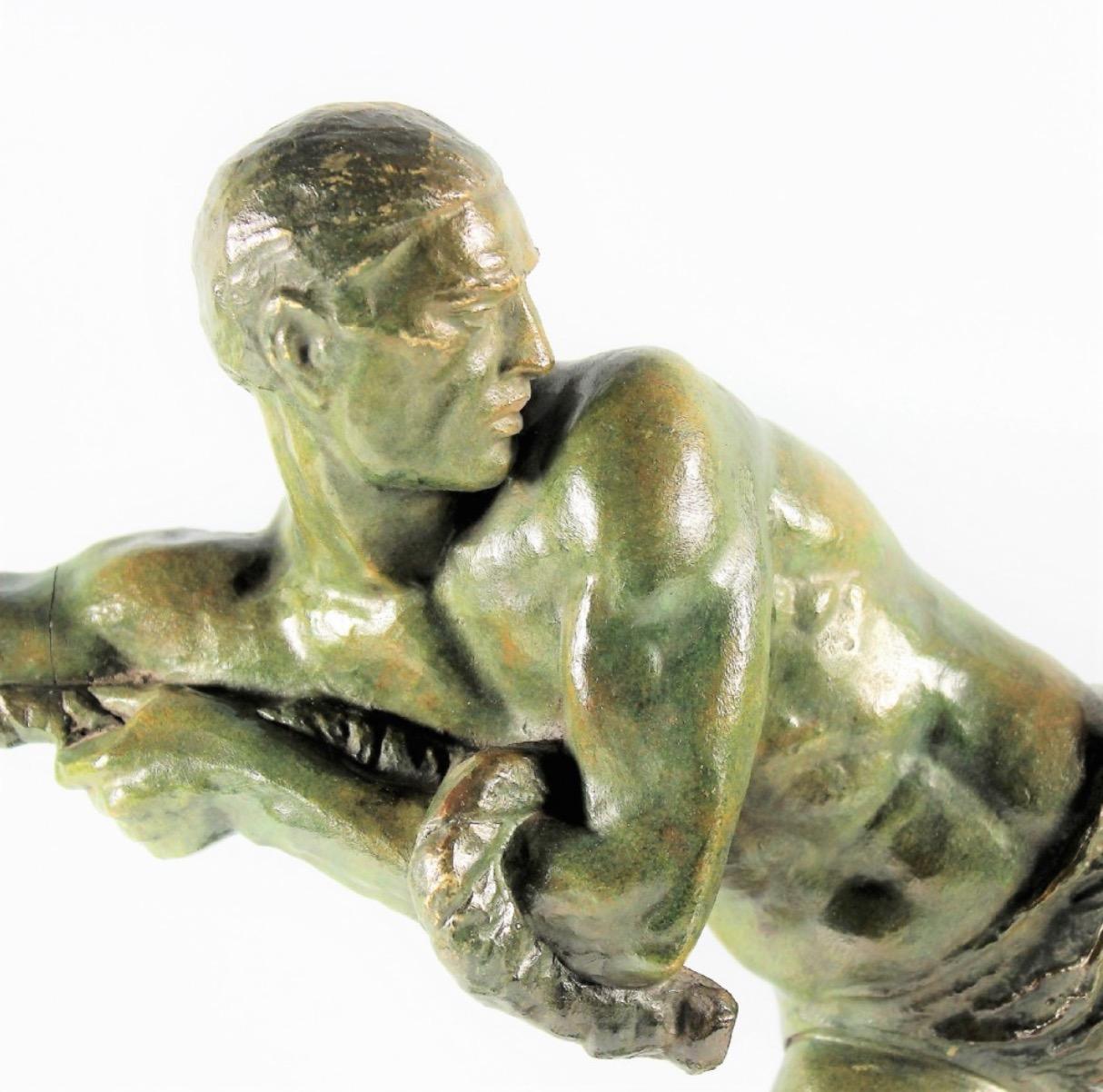 Art Deco sculpture by Pierre Le Faguays “Lariat” Bronze. Very large and rare male figure in cold painted green patinated bronze finish of male throwing a rope, mounted on a bronze wedge shaped base. Tremendous details, unusual texture portrayed in a