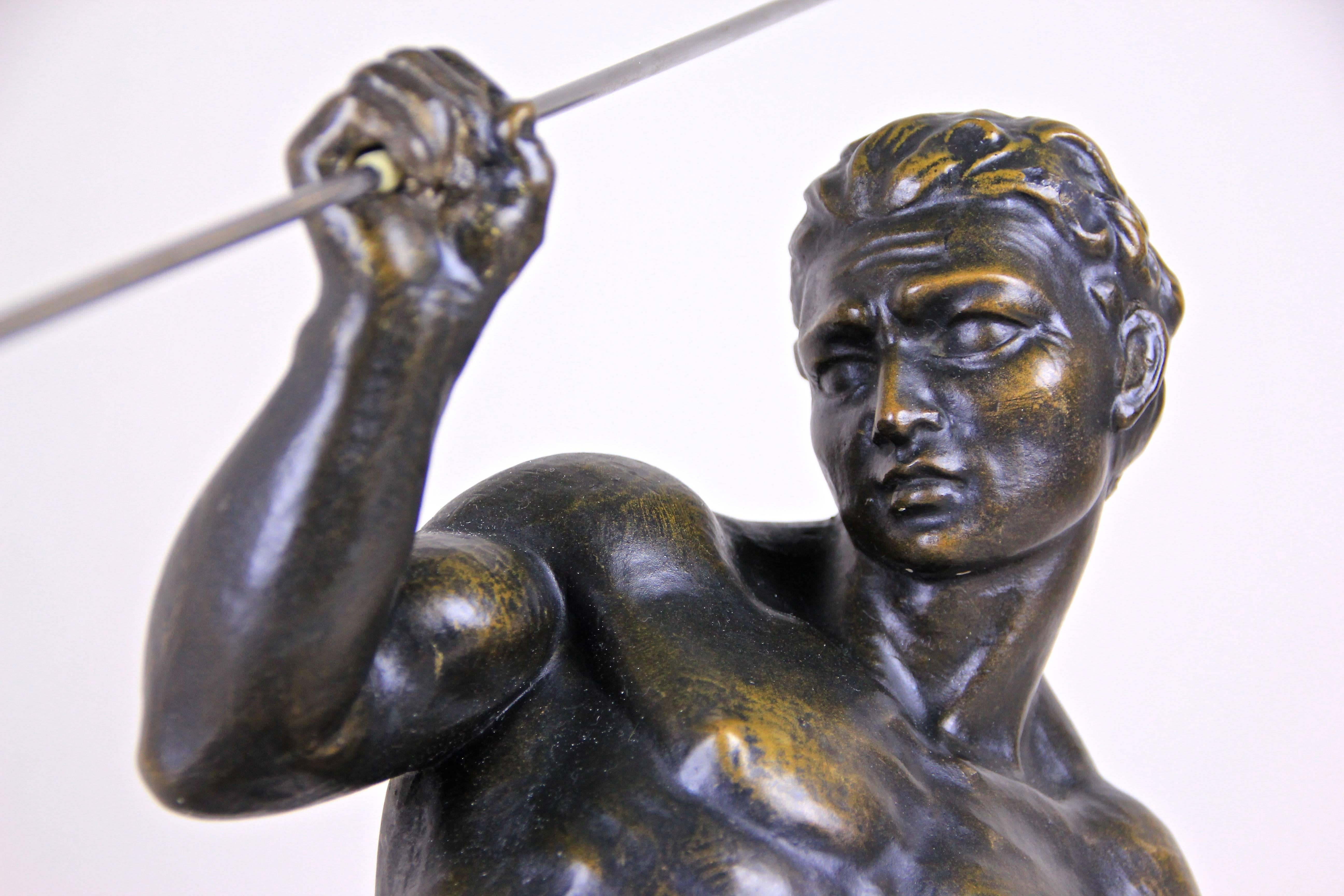 Fantastic large Art Deco sculpture by Italian sculptor Salvatore Melani (1902-1934) who worked in France. This great figural Art Deco plaster sculpture shows a roman javelin hurler made with highest attention to details. The sculpture surface