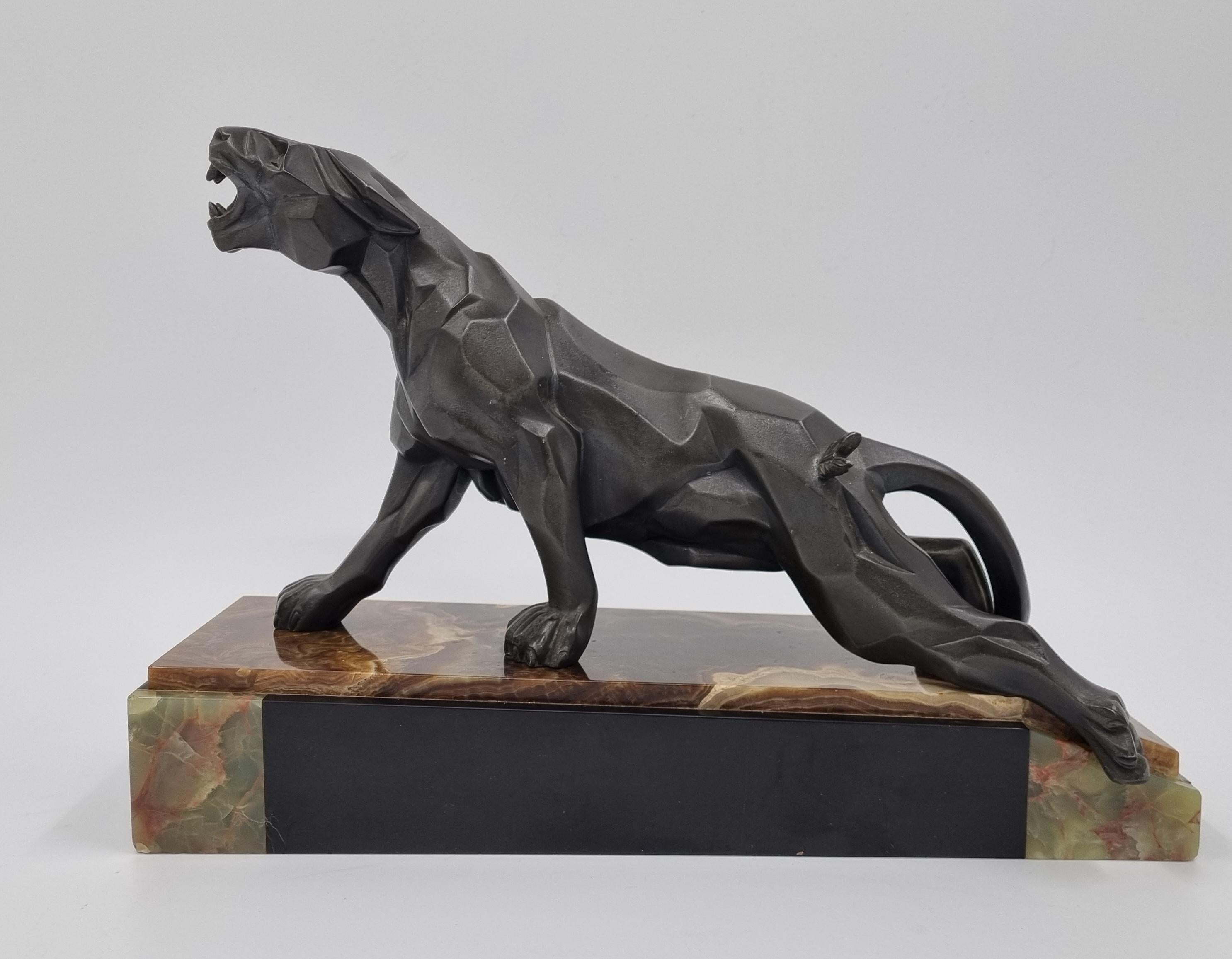 An extremely hard to find Art Deco cubist panther by A. Notari, signed to the Panthers tail.
Cast in cold painted spelter, resting on a multi-coloured marble and onyx base.
A wonderful and highly collectable cubist work in a very good and completely