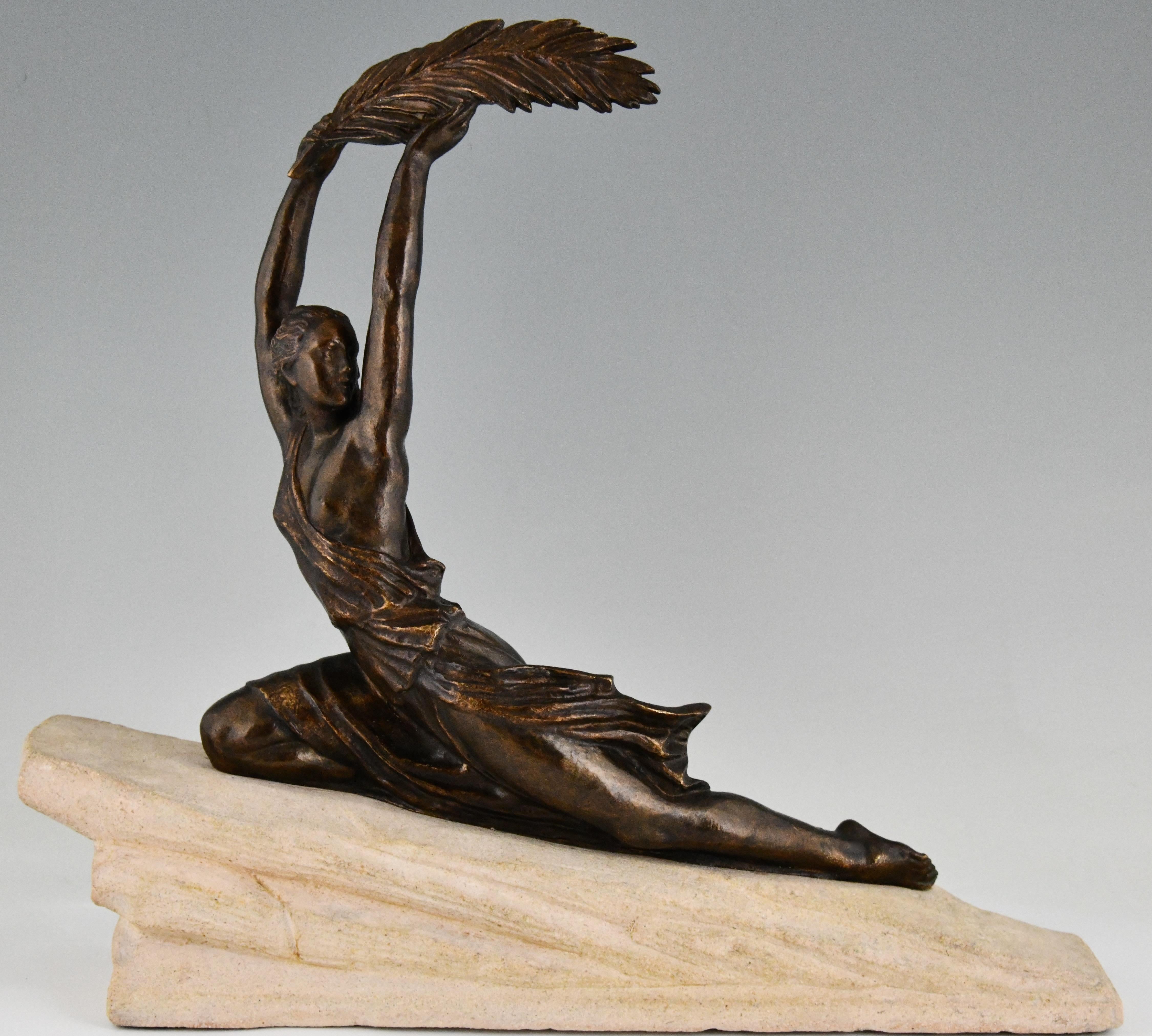 Art Deco sculpture female athlete with palm leaf by Fayral. 
Pseudonym of Pierre Le Faguays, France 1930. 
Patinated bronze on a stone base.