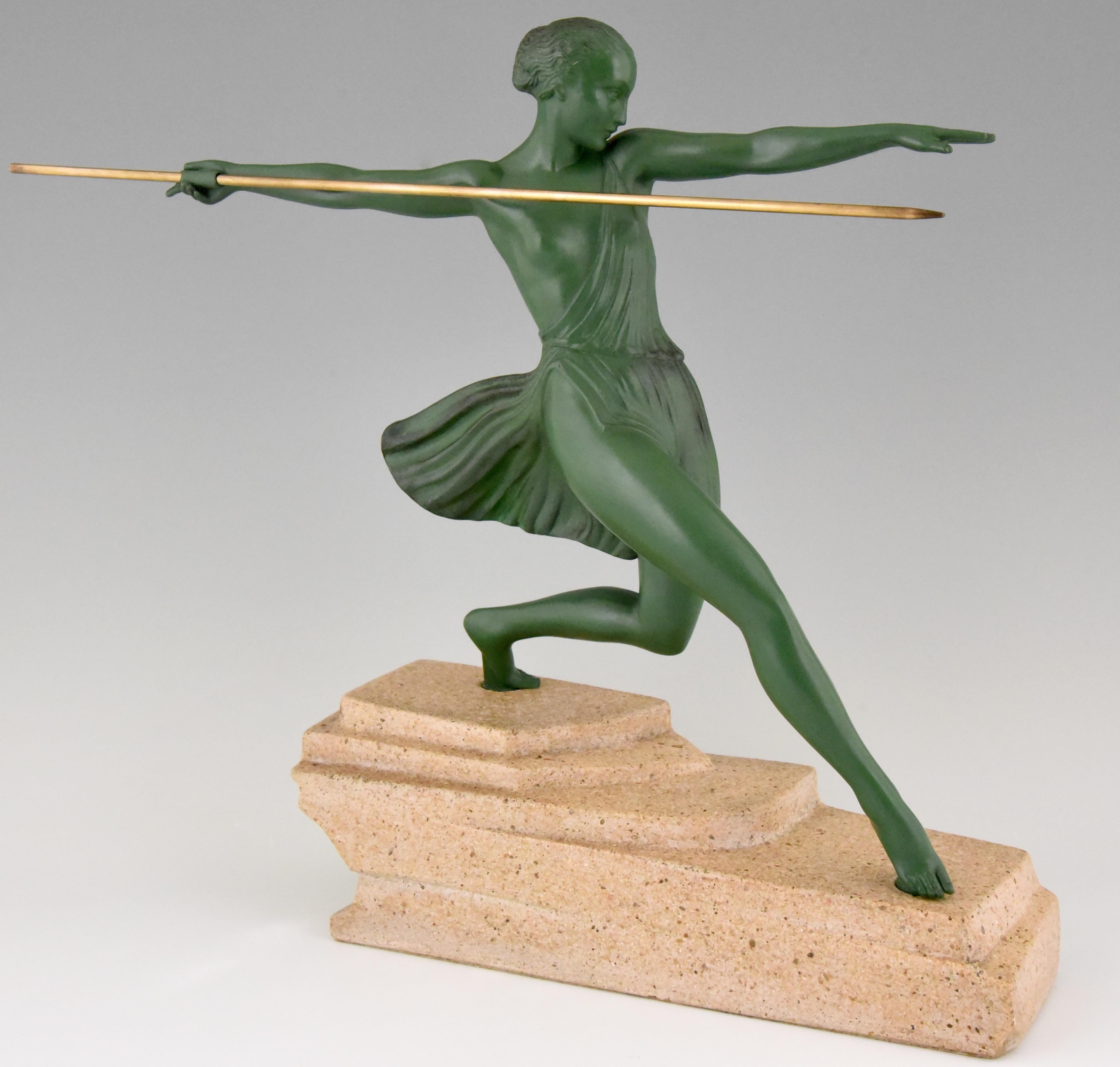 Hard to find Art Deco sculpture of a female javelin thrower by Fayral, the pseudonym of Pierre Le Faguays. The sculpture is in Art metal and has a lovely green patina. The figure stands on a signed stone base and was created in France, circa
