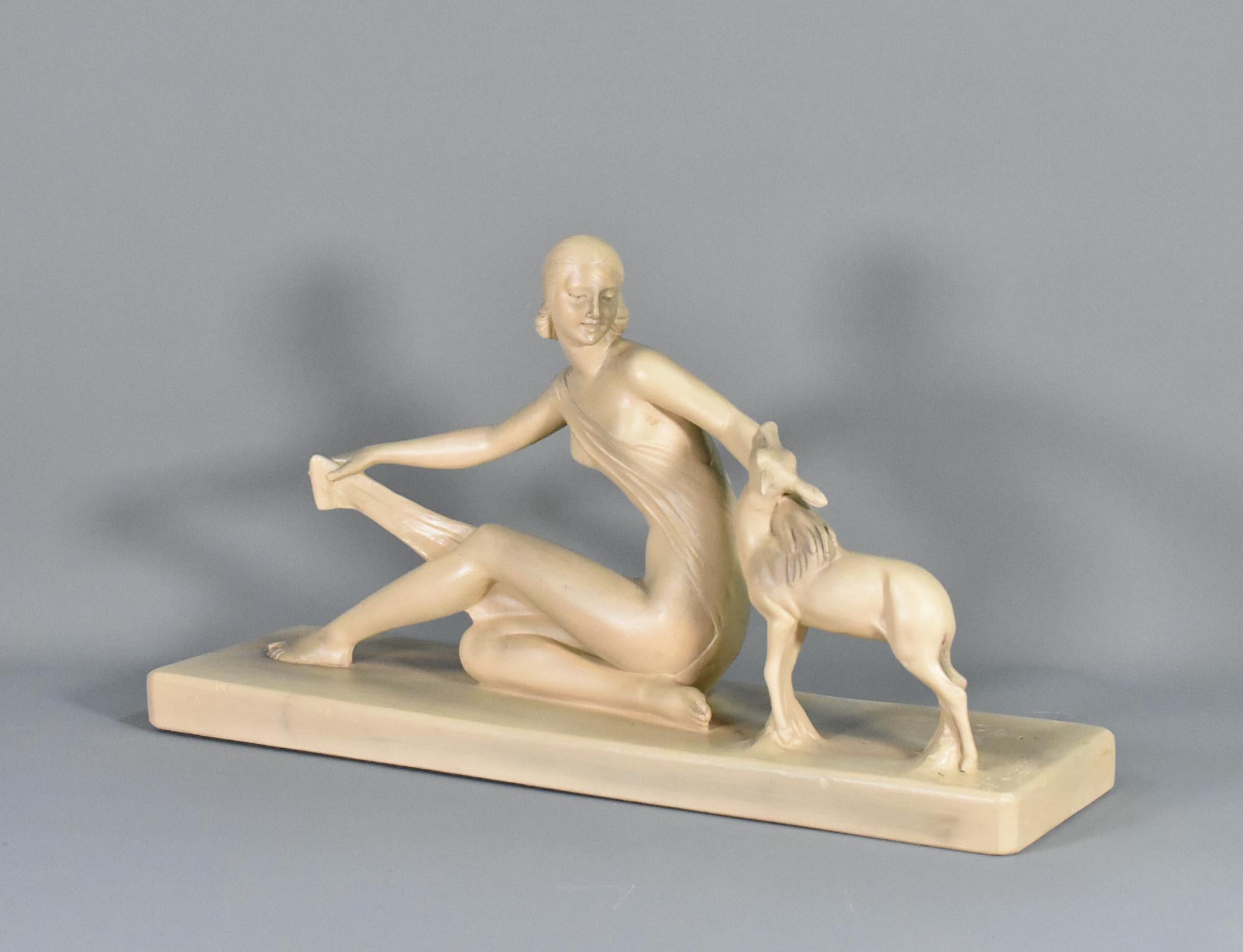 Art Deco Sculpture in Plaster signed S Melani 

A delightful art deco sculpture by Italian Salvatore Melani (1902 - 1934) of a woman sitting with her hand out-stretched towards a young deer. The woman has a wrap around dress that she is holding with