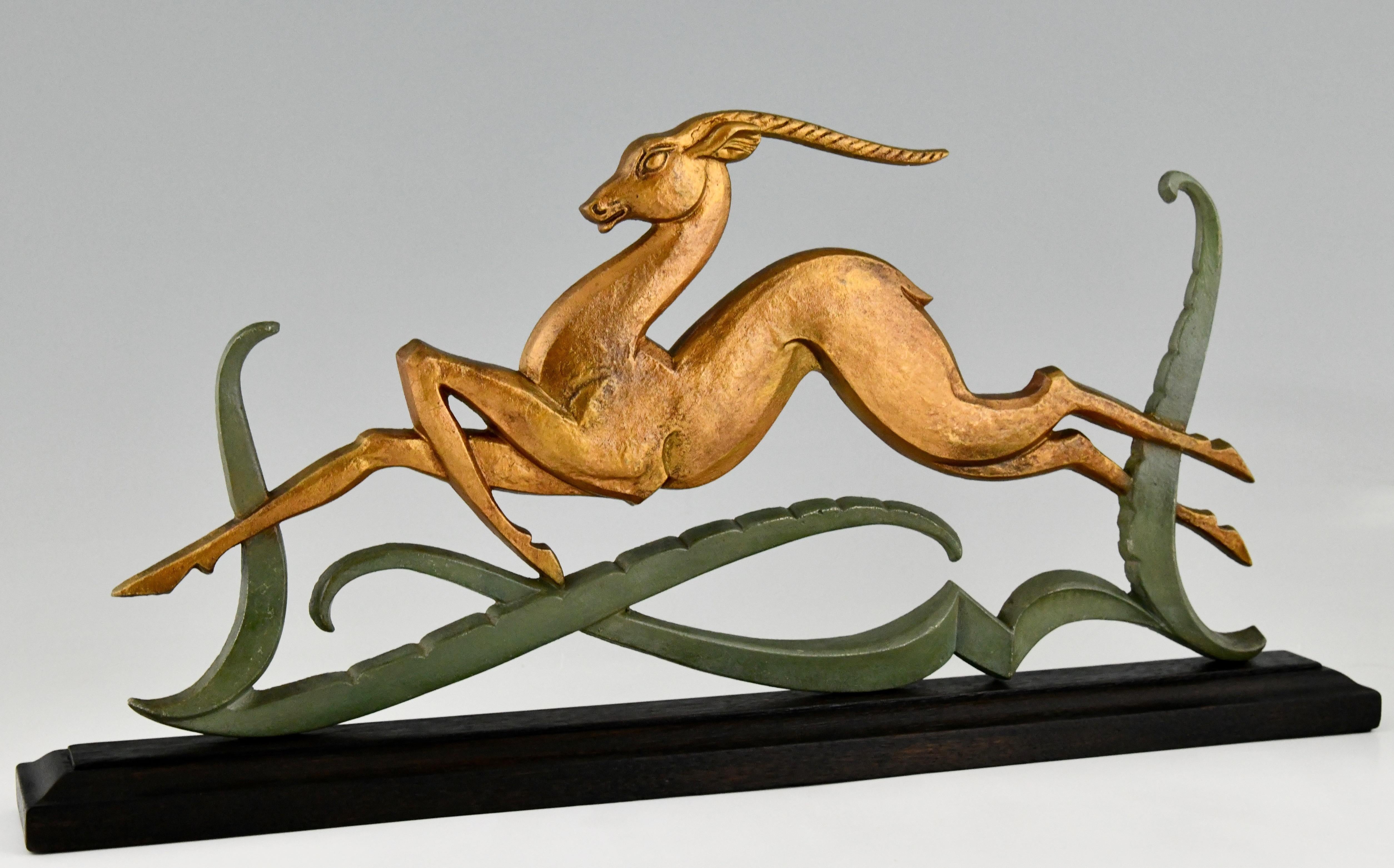 Art Deco sculpture leaping deer. Patinated metal. ? black wooden base. France 1930.