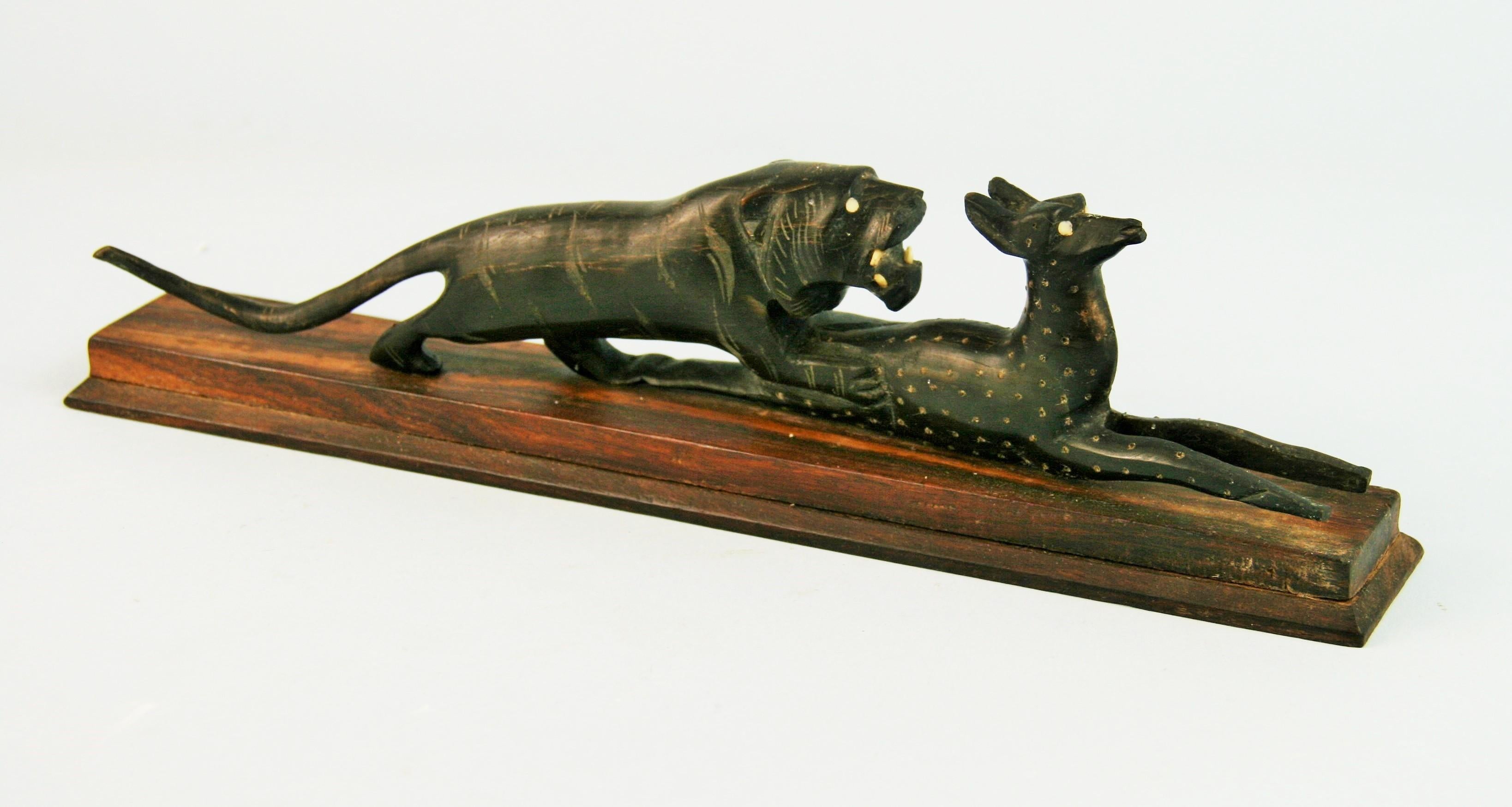 3-541  Japanese Art Deco Folk Art hand carved sculpture of a lioness and its gazelle prey.