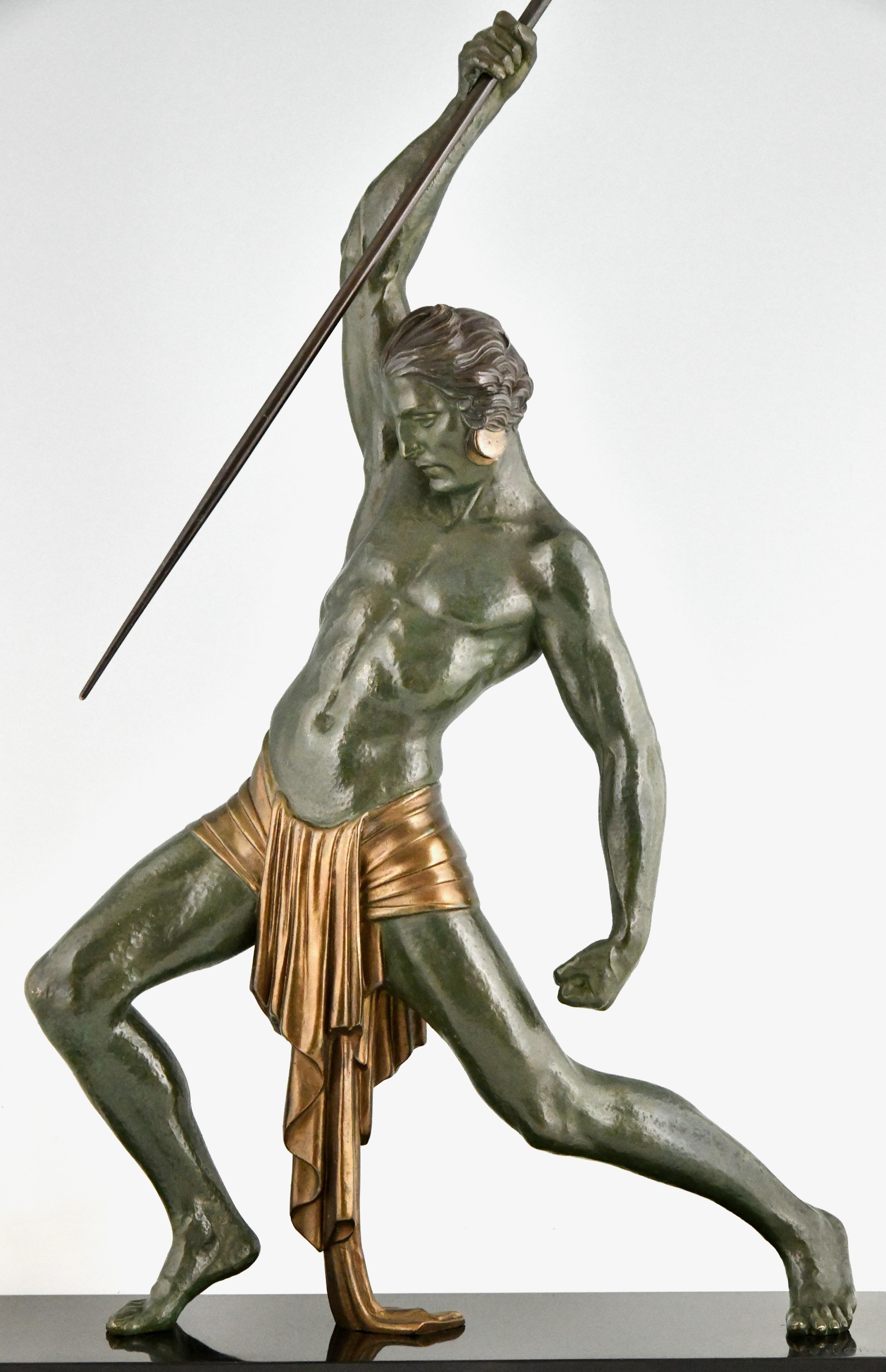 Art Deco sculpture man with spear by Demetre H. Chiparus.
Patinated Art Metal on a Belgian Black marble base.  
France 1934. 
This model called The Hunter is illustrated 3 times in the book:
Chiparus, Master of Art Deco, A. Shayo,
H. 87.5 including