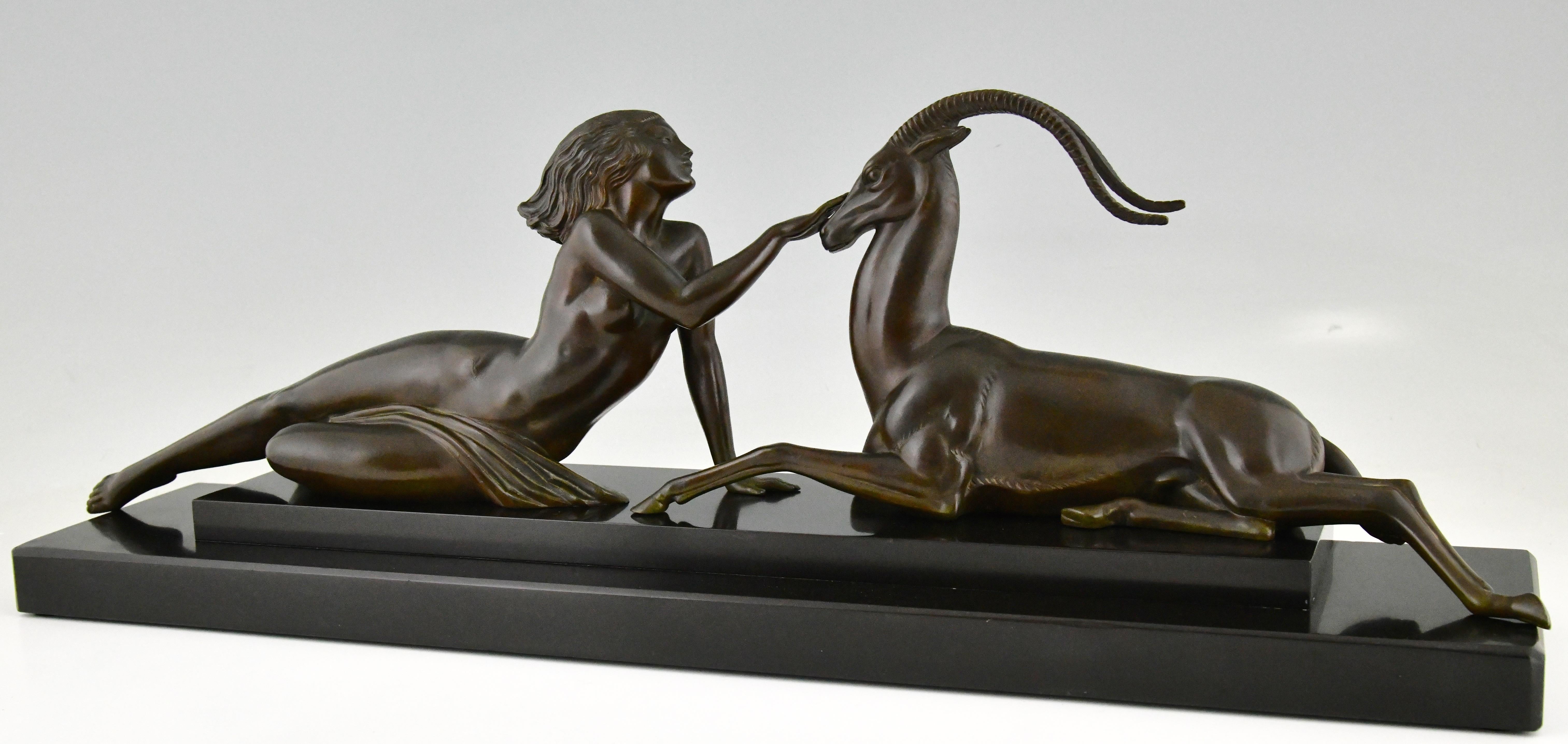 Seduction, elegant Art Deco sculpture of a nude lady with gazelle by Pierre Le Faguays for Max Le Verrier, signed Fayal. Art metal with dark green patina on a Belgian Black marble base. France 1930

This model is illustrated in several books: Art