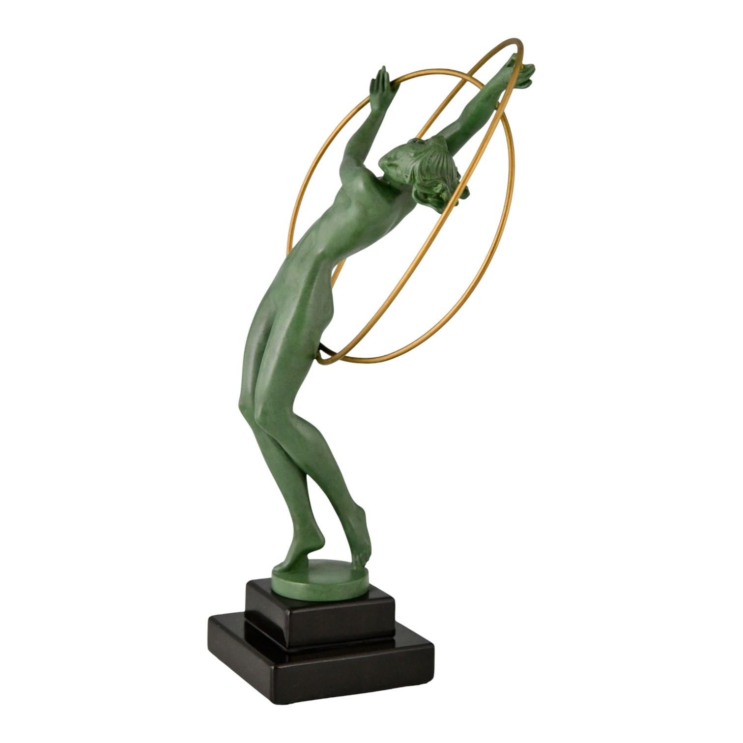 Elegant Art Deco sculpture Hoop Dancer titled ILLUSION created by Fayral (Pierre Le Faguays) for Max Le Verrier. The dynamic figure of a female dancer gracefully balancing with 2 hoops embodies the spirit of the 1930s Art Deco style. Signed Fayral,
