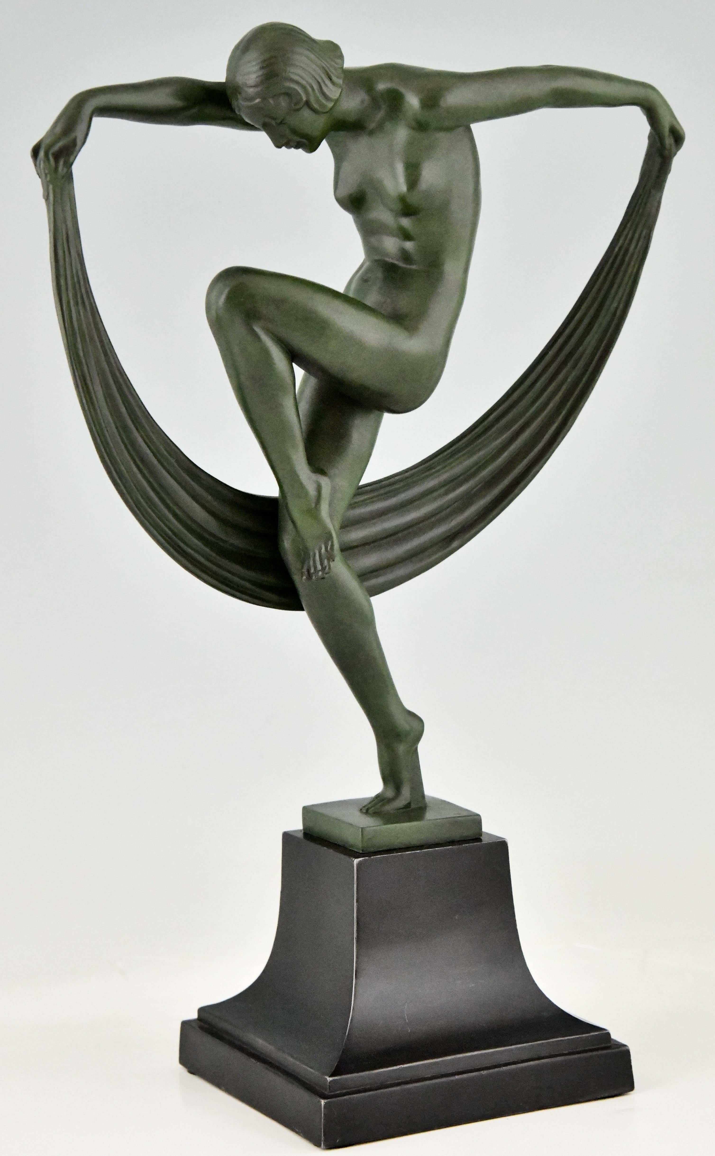Folie, elegant Art Deco sculpture of a nude dancer with scarf signed by Denis, cast at the Max Le Verrier foundry in France, circa 1930. 
Patinated Art Metal. 

This sculpture is illustrated in:
 “Bronzes, sculptors and founders” by H. Berman,