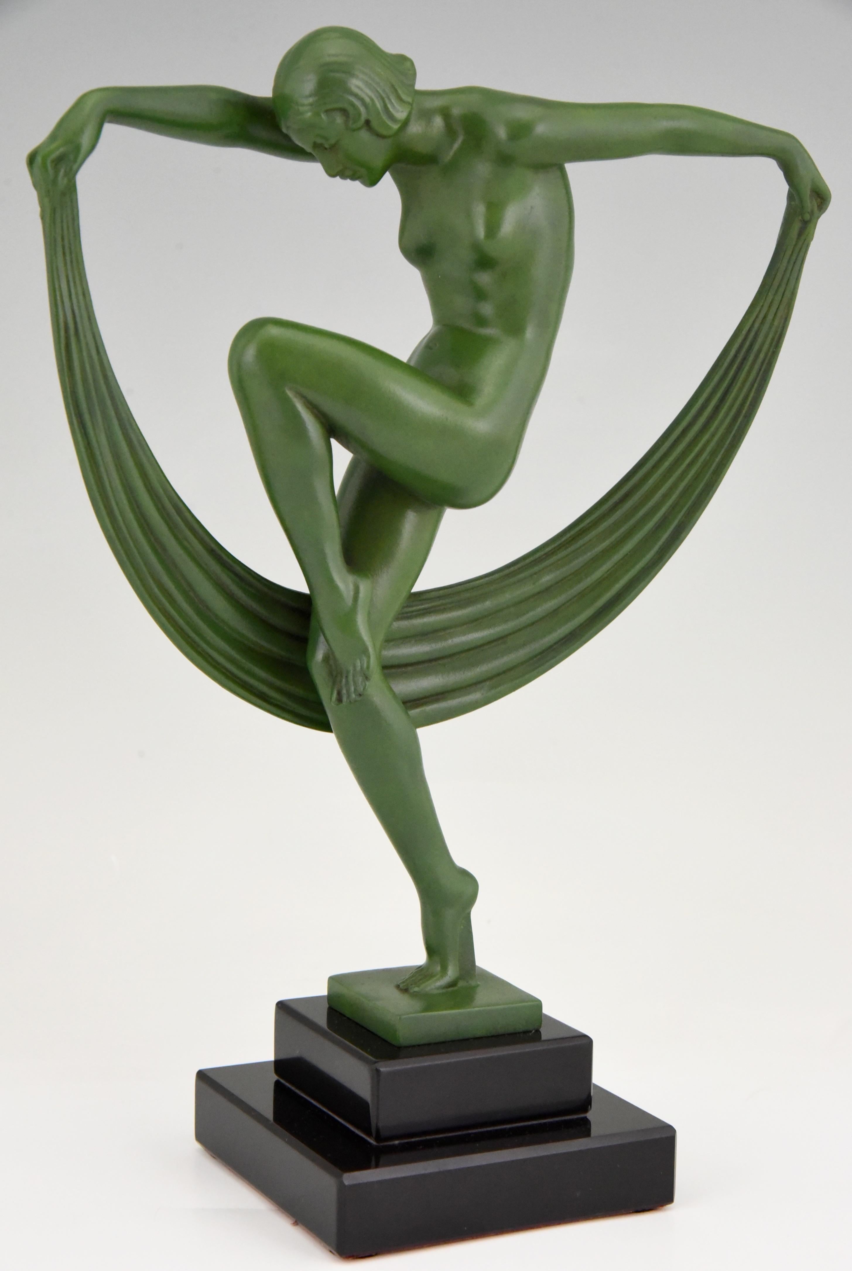 Folie, elegant Art Deco sculpture of a nude dancer with scarf signed Denis, cast at the Max Le Verrier foundry in France, circa 1930. 
Patinated Art Metal on a Belgian Black marble base. 

This sculpture is illustrated in:? “Bronzes, sculptors