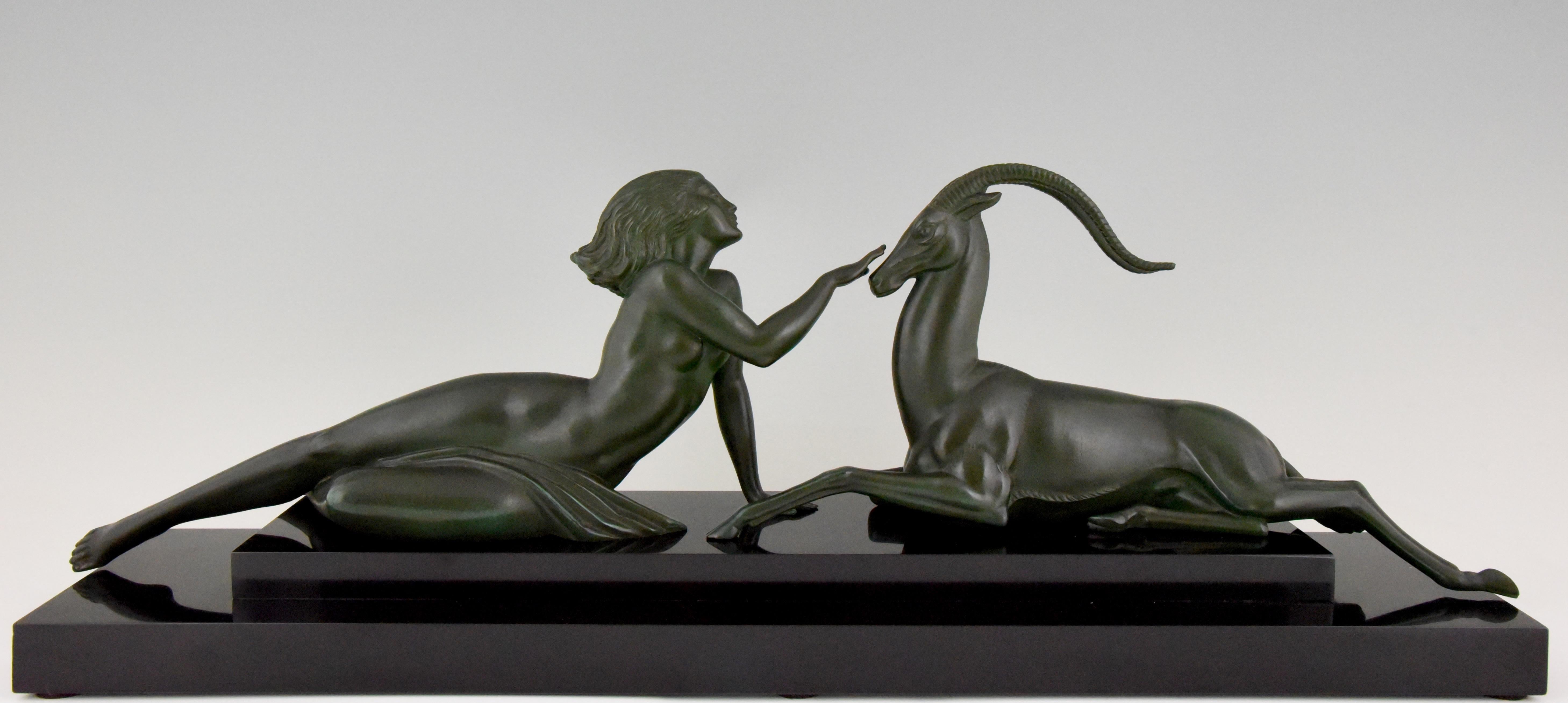 Seduction, Art Deco sculpture of a nude with gazelle. Signed by Fayral, Pierre Le Faguays, France 1930 with Max Le Verrier foundry mark. Art metal with dark green patina on Belgian Black marble base.
This model is illustrated in on page 1149