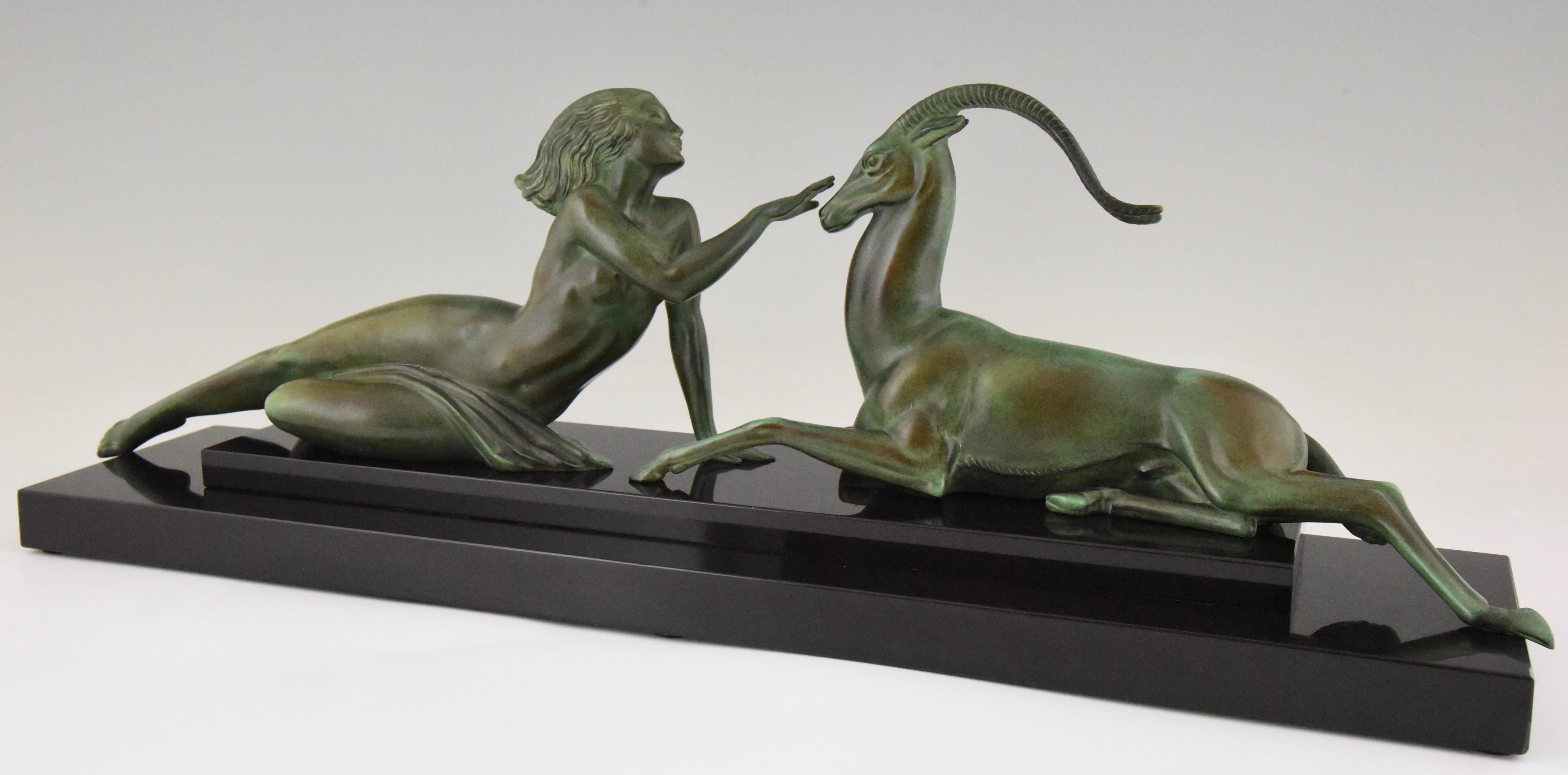 Seduction, elegant Art Deco sculpture of a nude with gazelle by Pierre Le Faguays. Art metal with green patina on a Belgian Black marble base. France 1930

This model is illustrated in several books:?
“Art Deco sculpture” by Victor Arwas,