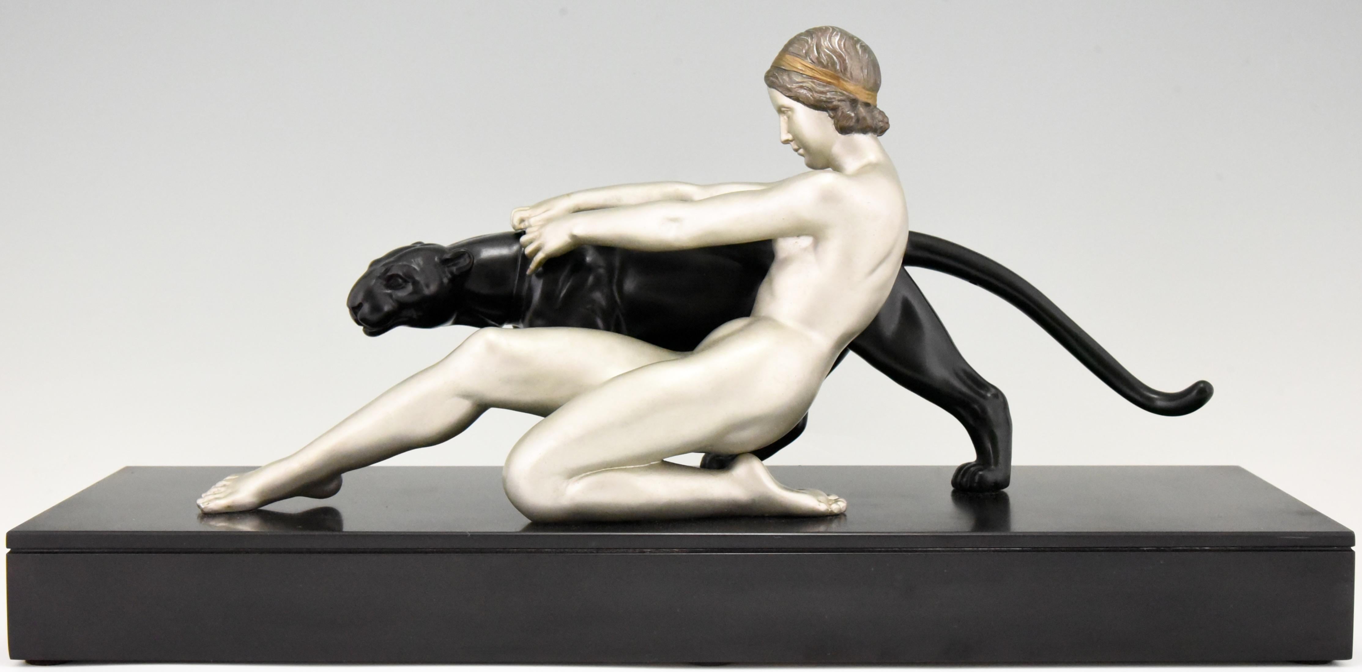 Art Deco sculpture of a nude with a panter on a Belgian black marble base by the French artist Alexandre Ouline, who worked in France, 1918-1940. The Art metal sculpture has a silver and black patina.
Literature:
“Animals in bronze” by Christopher