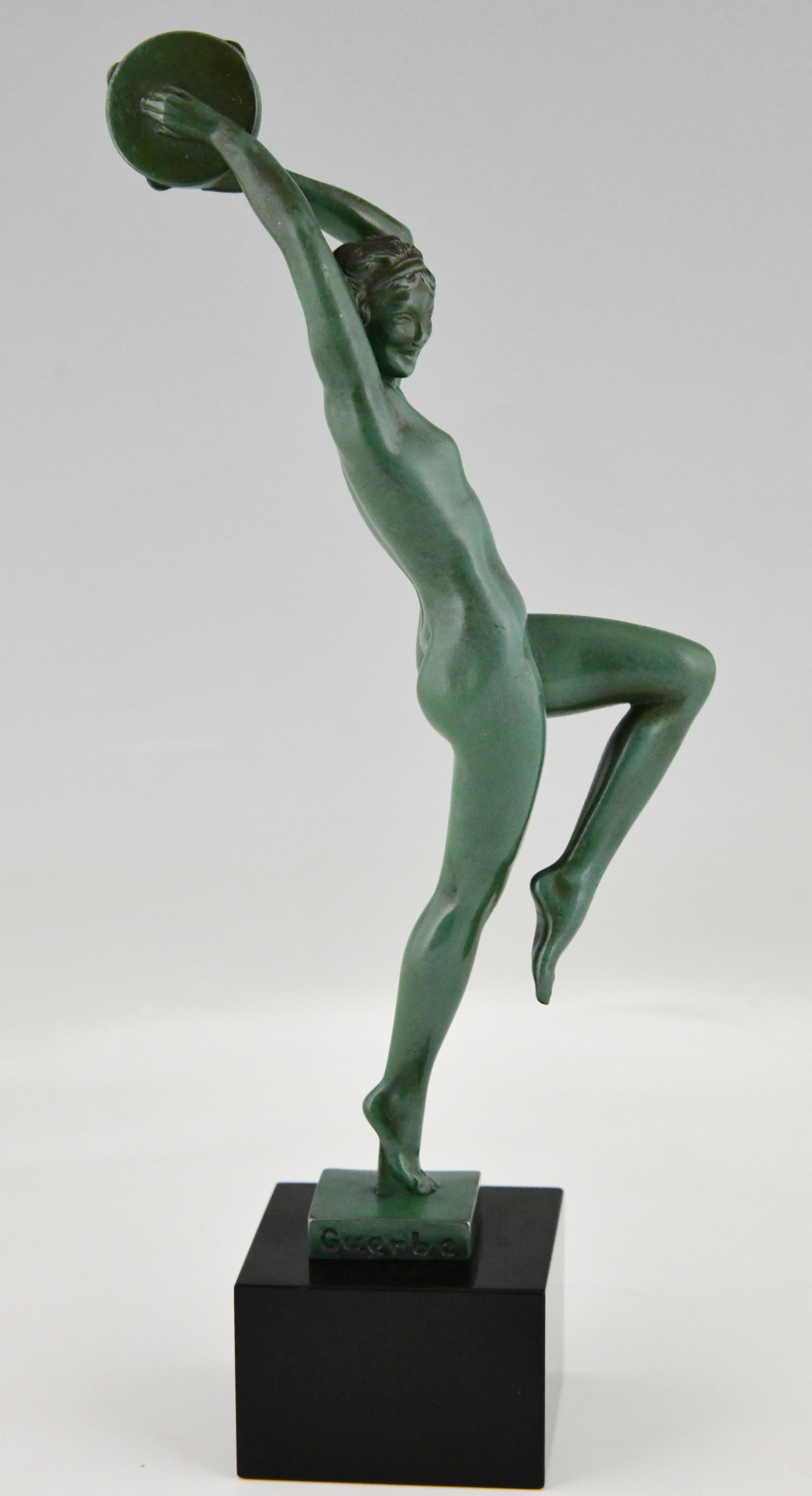 Art Deco sculpture nude with tambourine by Raymonde Guerbe.
The sculpture is in patinated Art metal and stands on a Belgian black marble base.
France 1930. 

Bronzes, sculptors and founders by H. Berman, Abage.
Art deco and other figures by