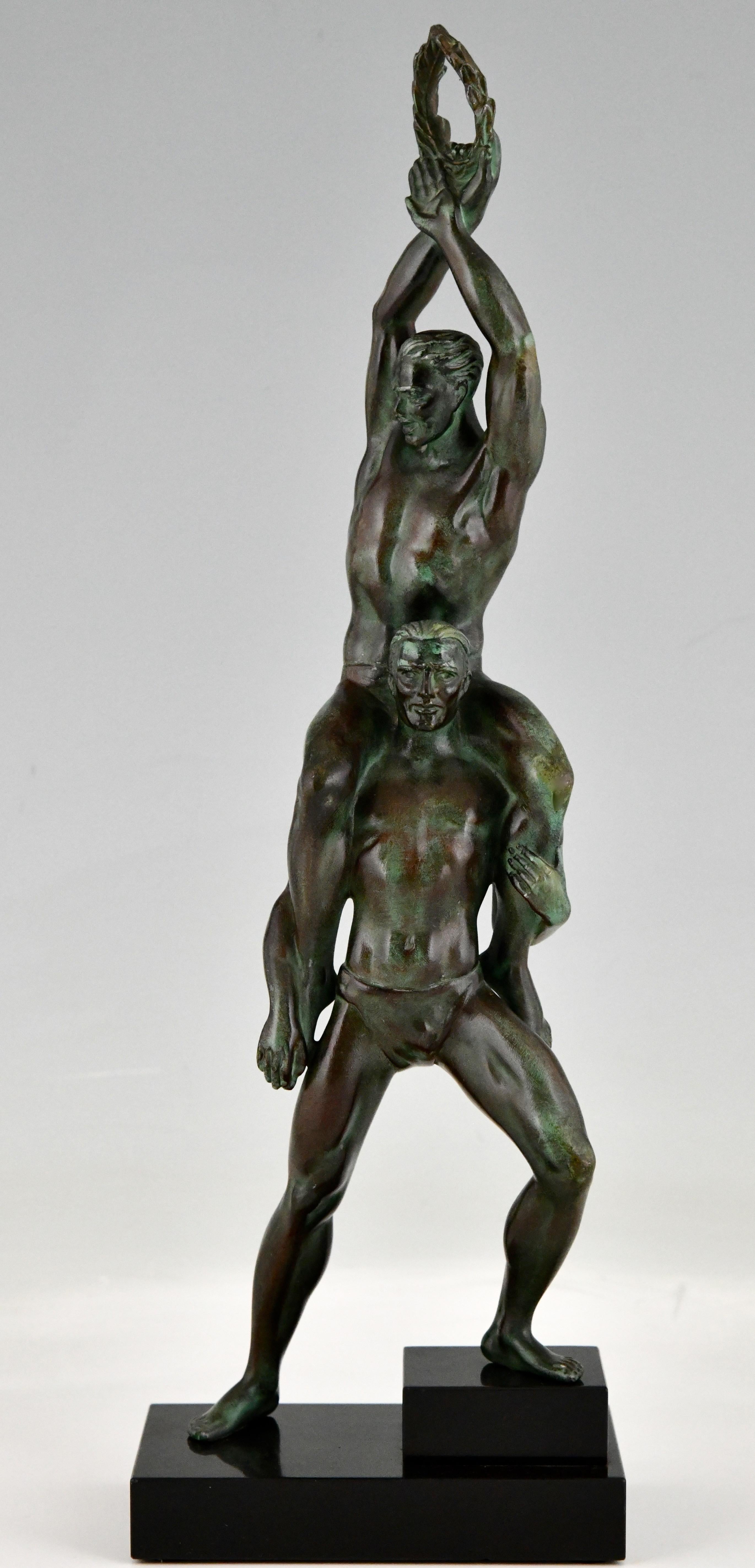 Art Deco sculpture of 2 athletes with laurel wreath by Pierre Le Faguays. 
Art Metal, green patina on Belgian black marble base. 
France 1930.