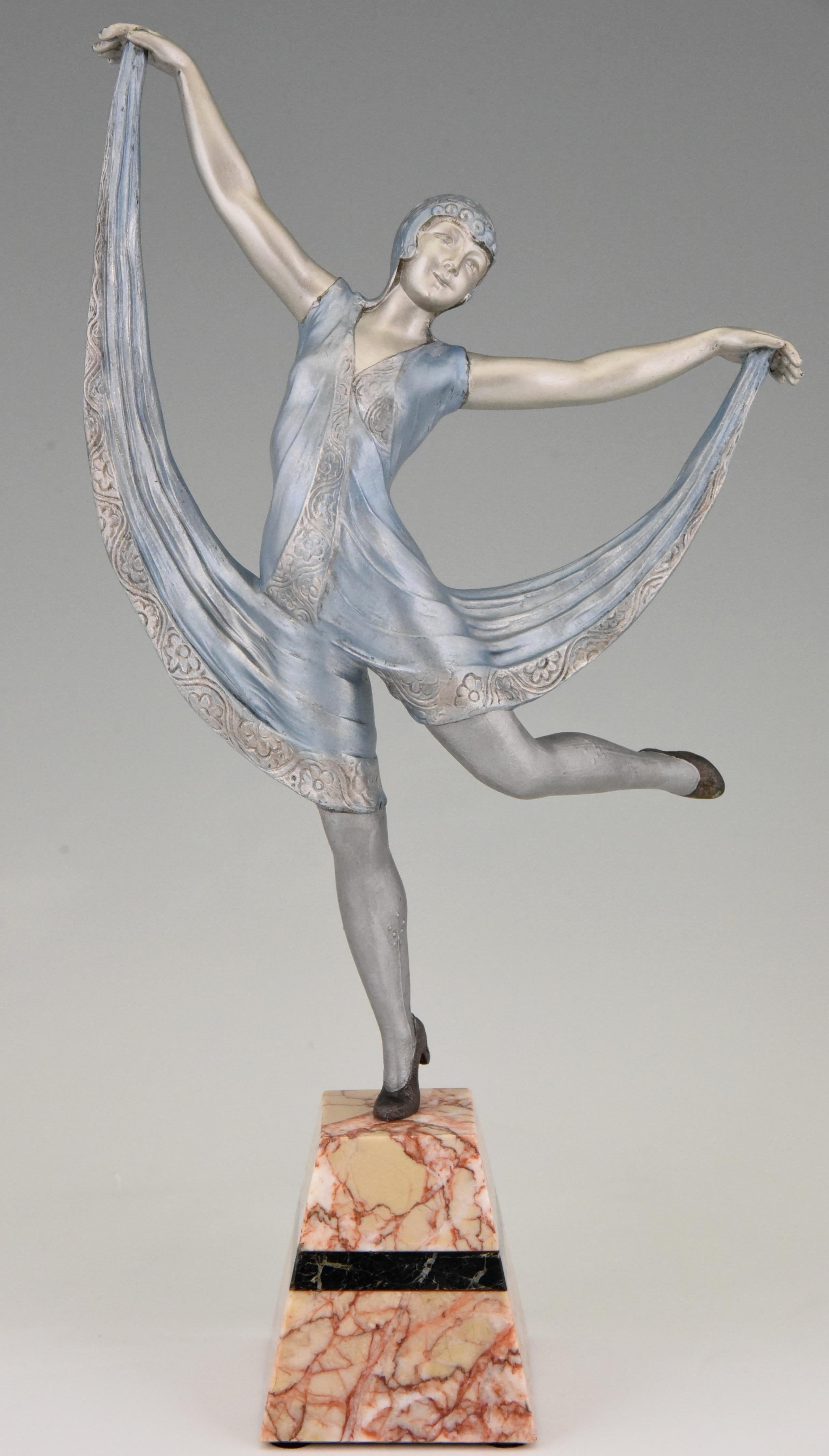 Lovely sculpture of a female dancer in a blue dress. The work is signed by Limousin, a French sculptor.
Executed in art metal with silver and light blue patina, the base is in marble and has a black marble inlay.
France, 1930.