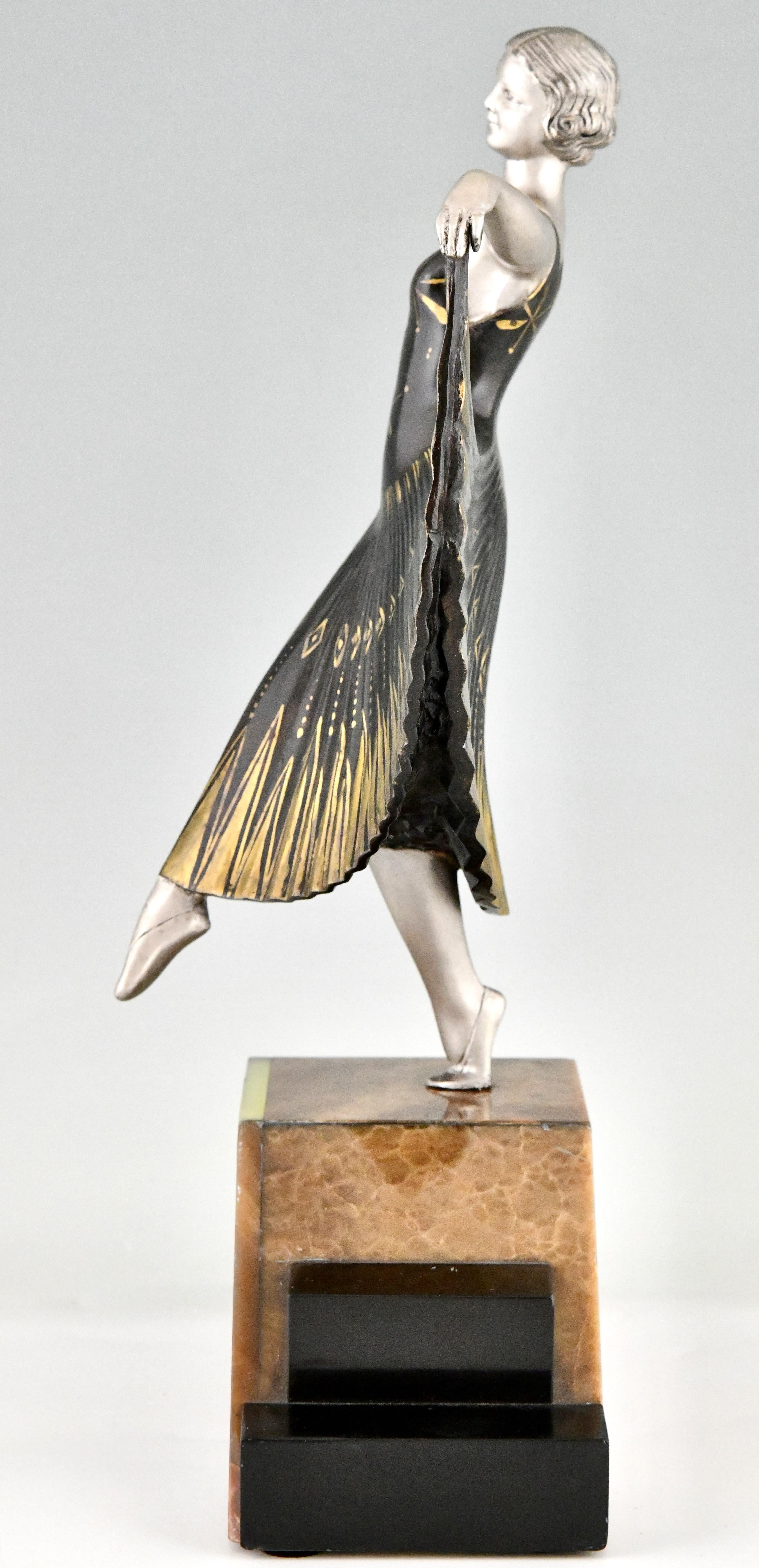 Escultura Art Déco de una bailarina firmada por Andre Gilbert Metal