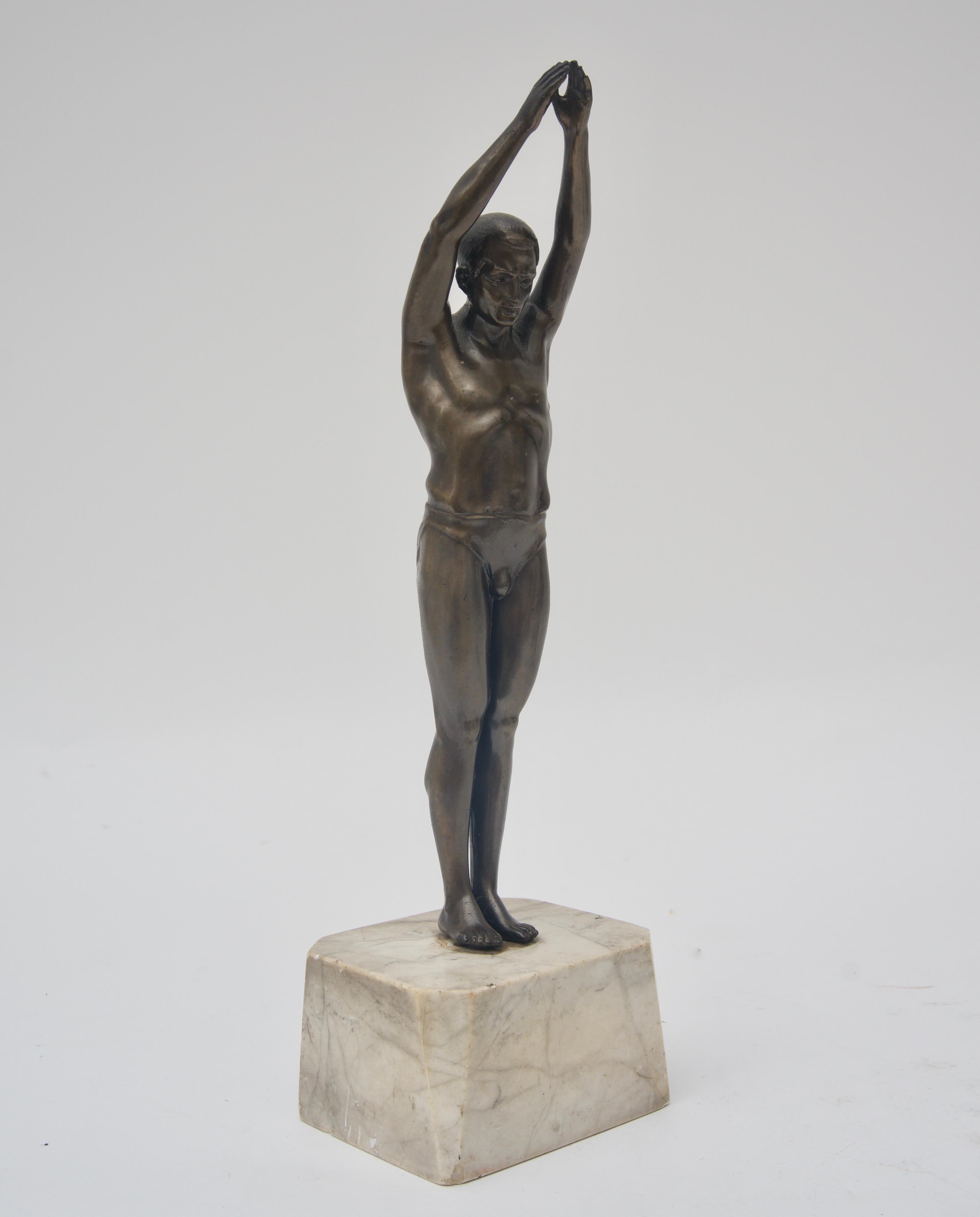 This stylish German Art Deco sculpture of a male diver was acquired from a South Beach, Florida estate and it date to the 1930s.

Note: Base dimensions are 3.25