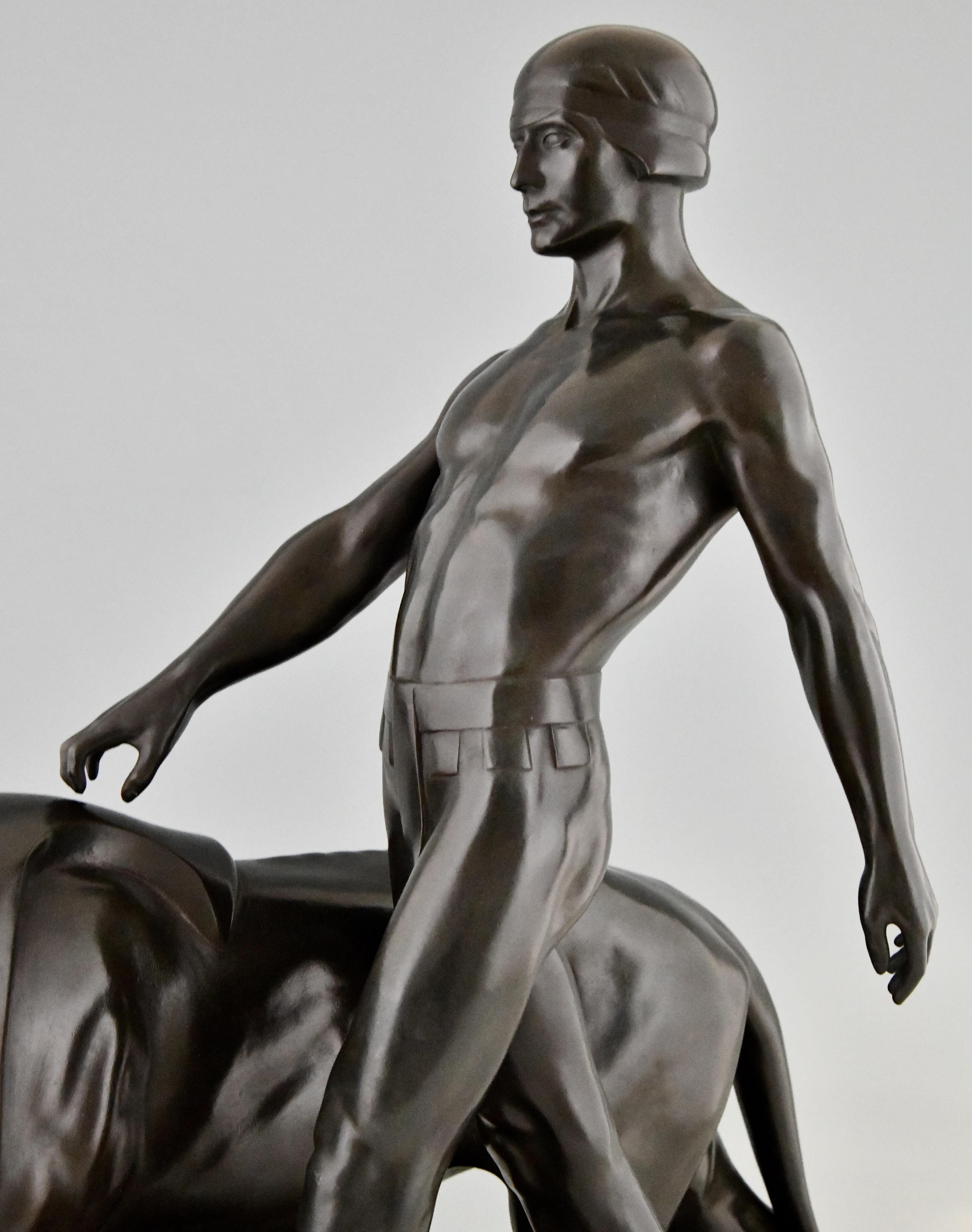 Art Deco Sculpture of a Male Nude Walking with Lion Belluaire Max Le Verrier 192 4