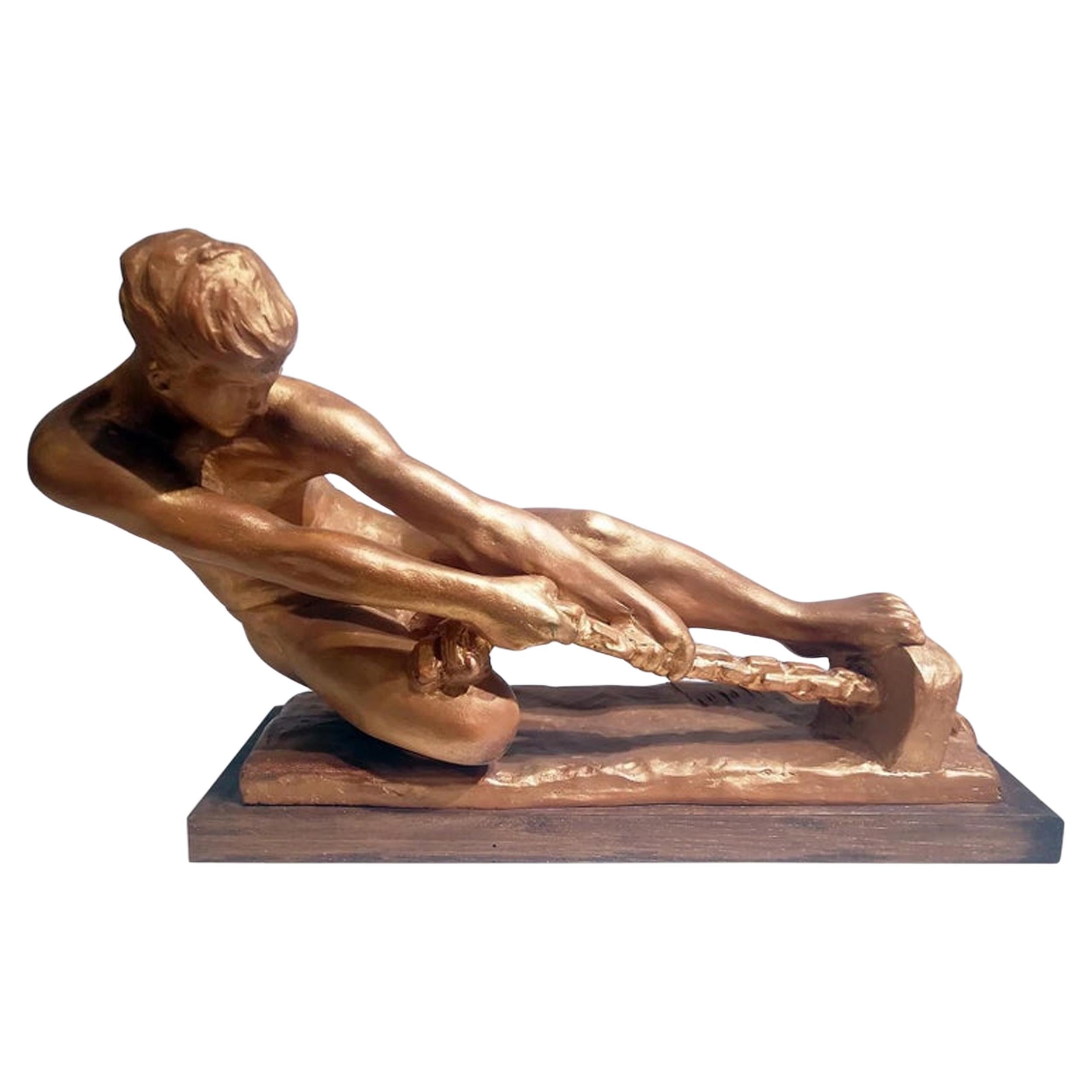 Escultura Art Decó de un varón tirando de una cuerda firmada "Alexandre Kelety"