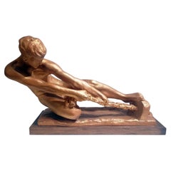 Escultura Art Decó de un varón tirando de una cuerda firmada "Alexandre Kelety"