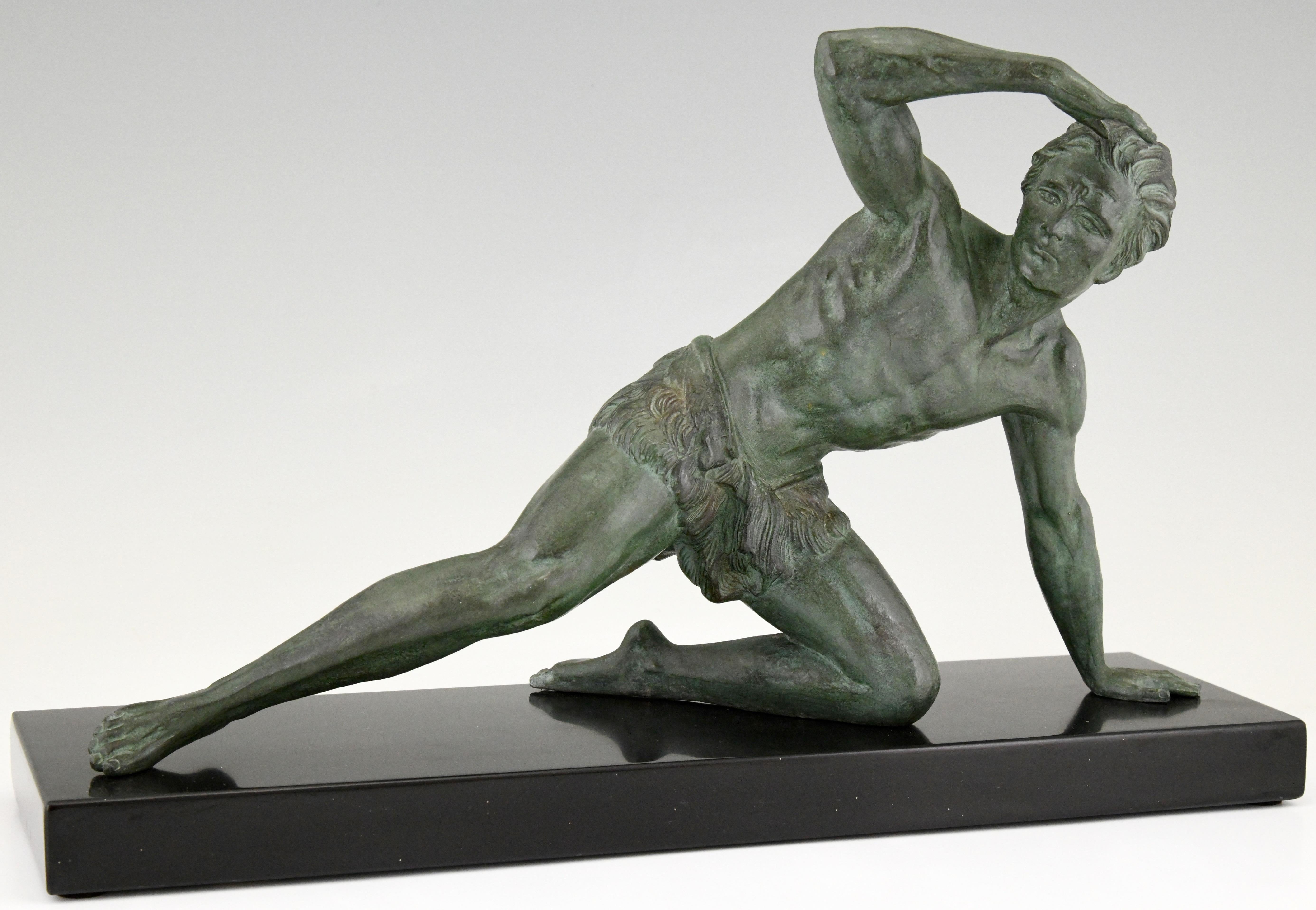 Art Deco sculpture of a man on the lookout by Jean de Roncourt, France, ca. 1930.
The sculpture has a beautiful green patina with lighter shades and stands on a Belgian black marble plinth.
  