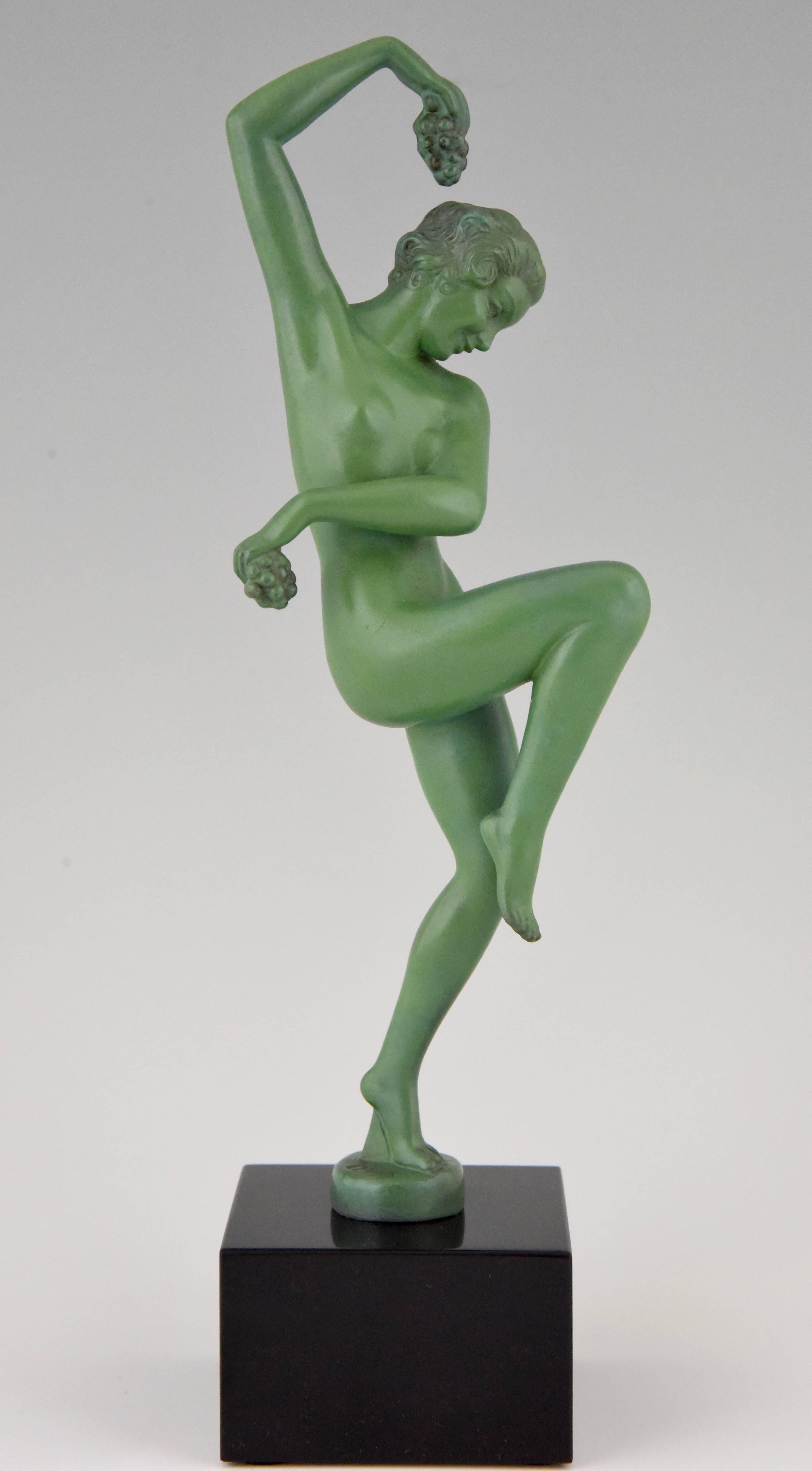 Typical Art Deco sculpture of a nude dancer with grapes, cast in art metal with a lovely green patina, mounted on a Belgian balck marble base. The statue is signed Denis, France, 1930. 

Signature/ Marks: Denis.
Style: Art Deco
Date: