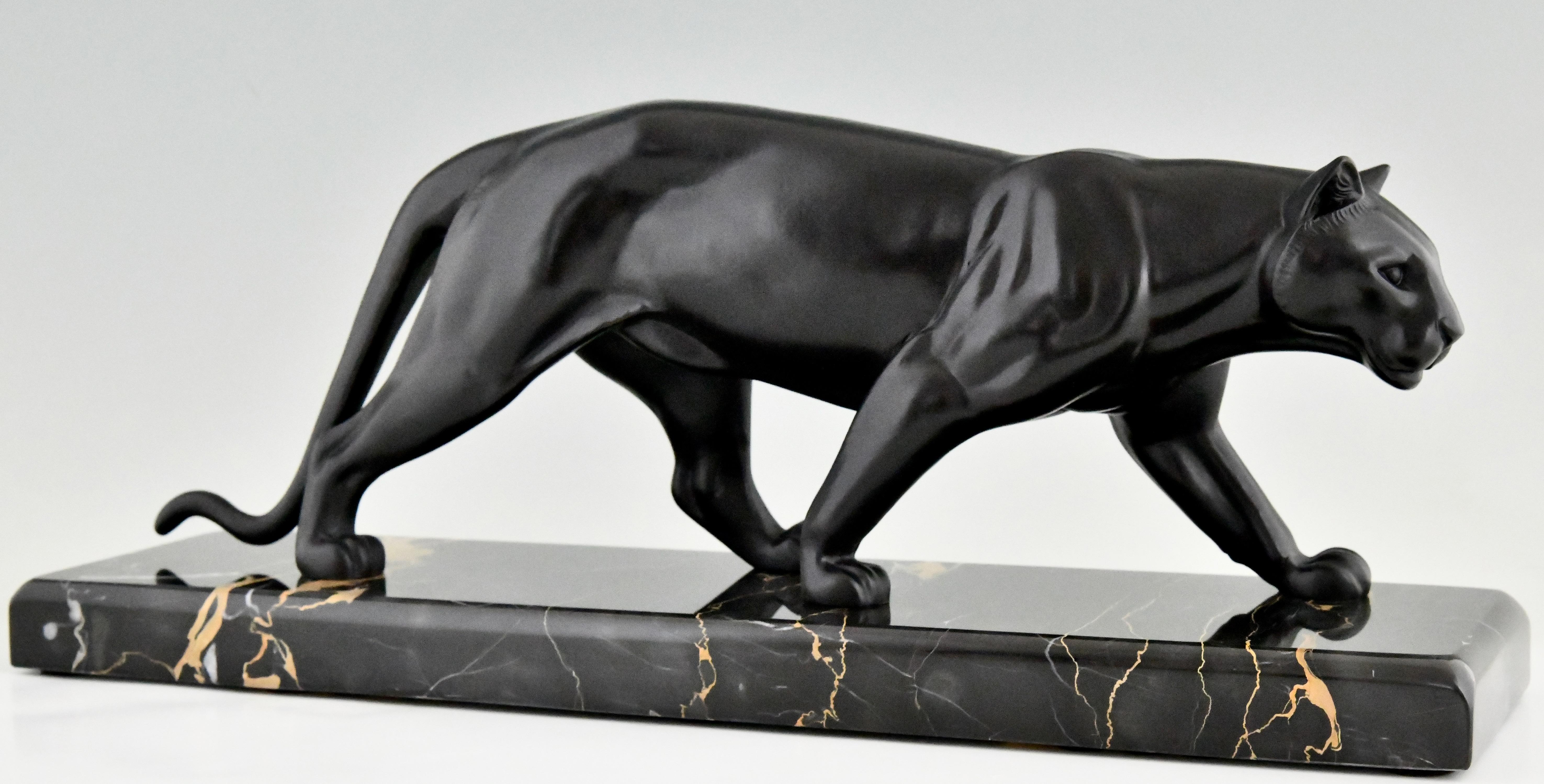 Art Deco sculpture of a panther by M. Leducq.
Patinated Art metal on a Portor marble base. 
France 1930.