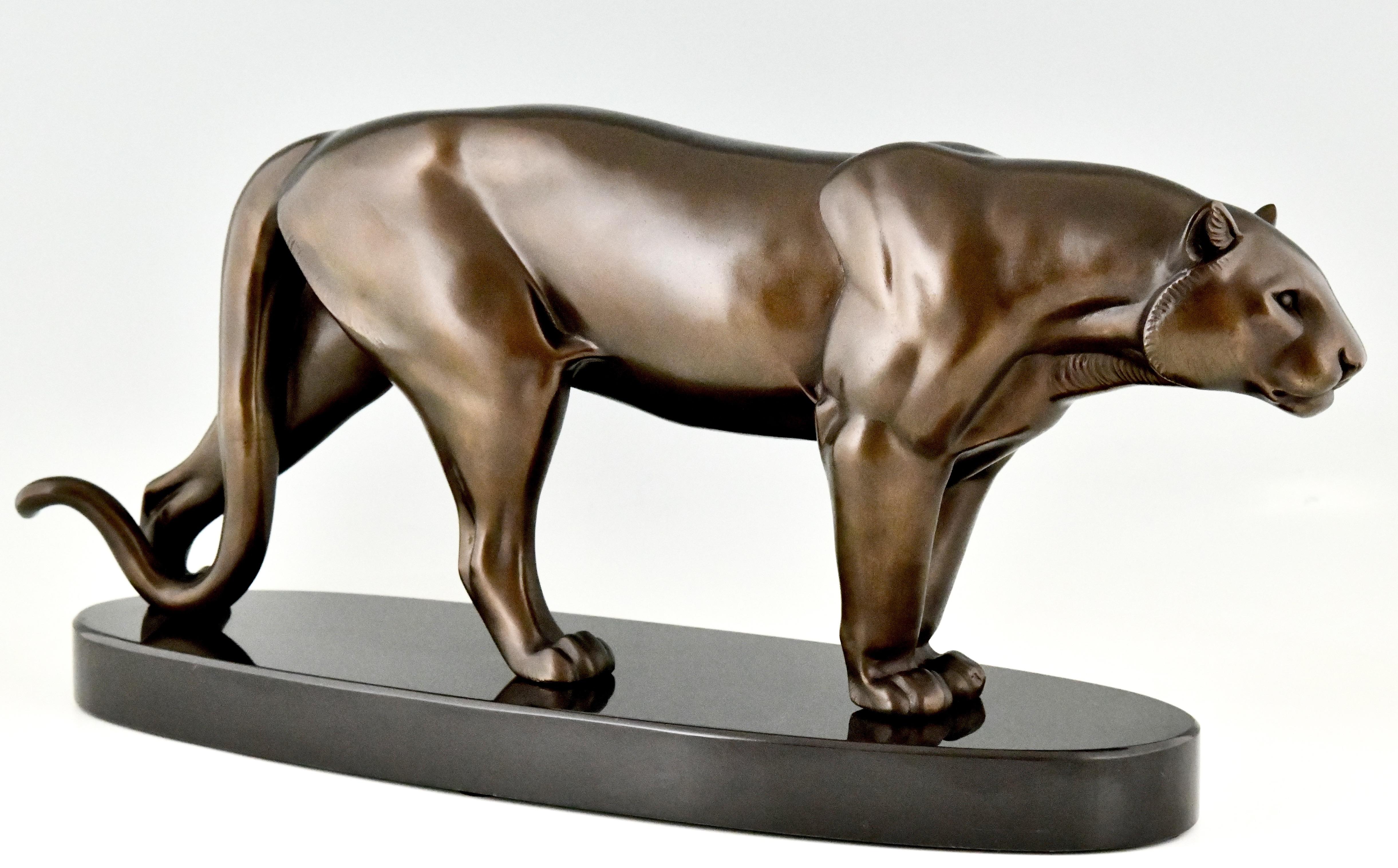 Impressive Art Deco sculpture of a panther signed Rulas, a sculptor who worked in France ca. 1920-1930. Patinated metal on a Belgian Black oval base.