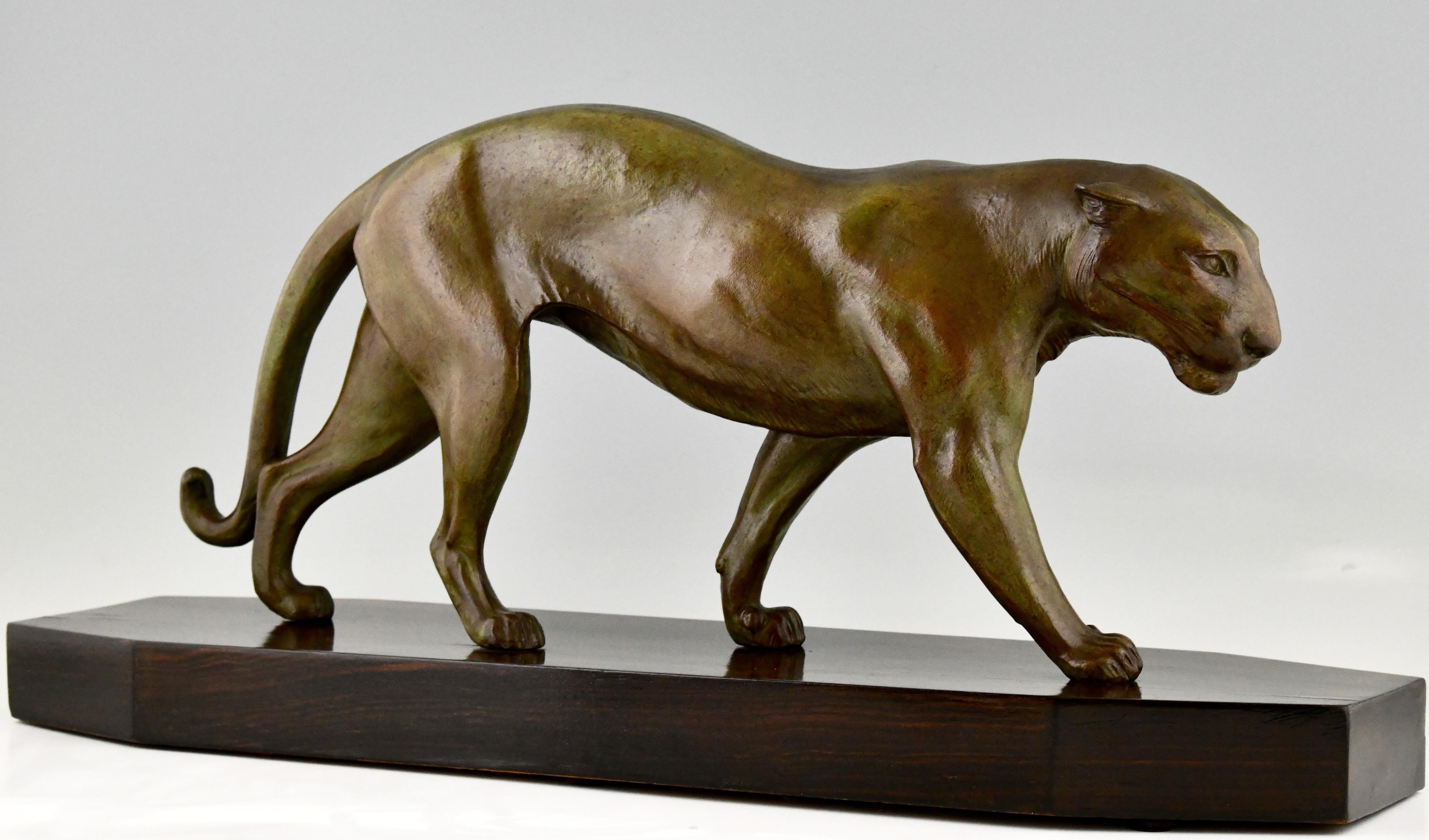 Elegant Art Deco sculpture of a panther by the French artist Robert Bousquet. Patinated metal on a fine Macassar wooden base. Ca. 1930.
Literature:
“Bronzes, sculptors and founders” H. Berman, Abage. ?