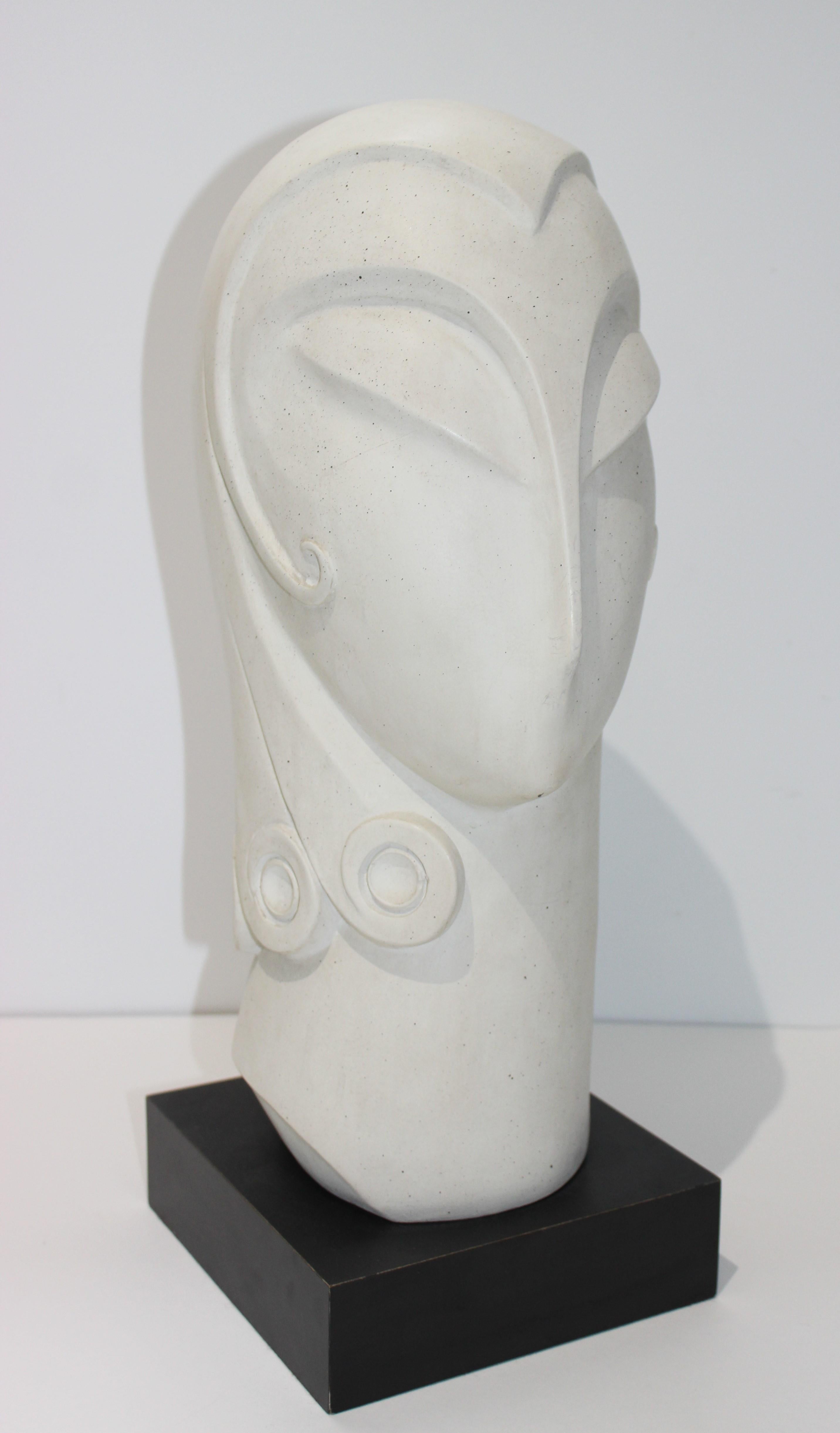 This large scale Austin Productions Art Deco style sculpture of a womans head showing off her stylish hairdo dates to 1985 and definitely has overtones of the exotic Asian influence of the 1920s and 1930s.

The sculptors name was Fisher, but we