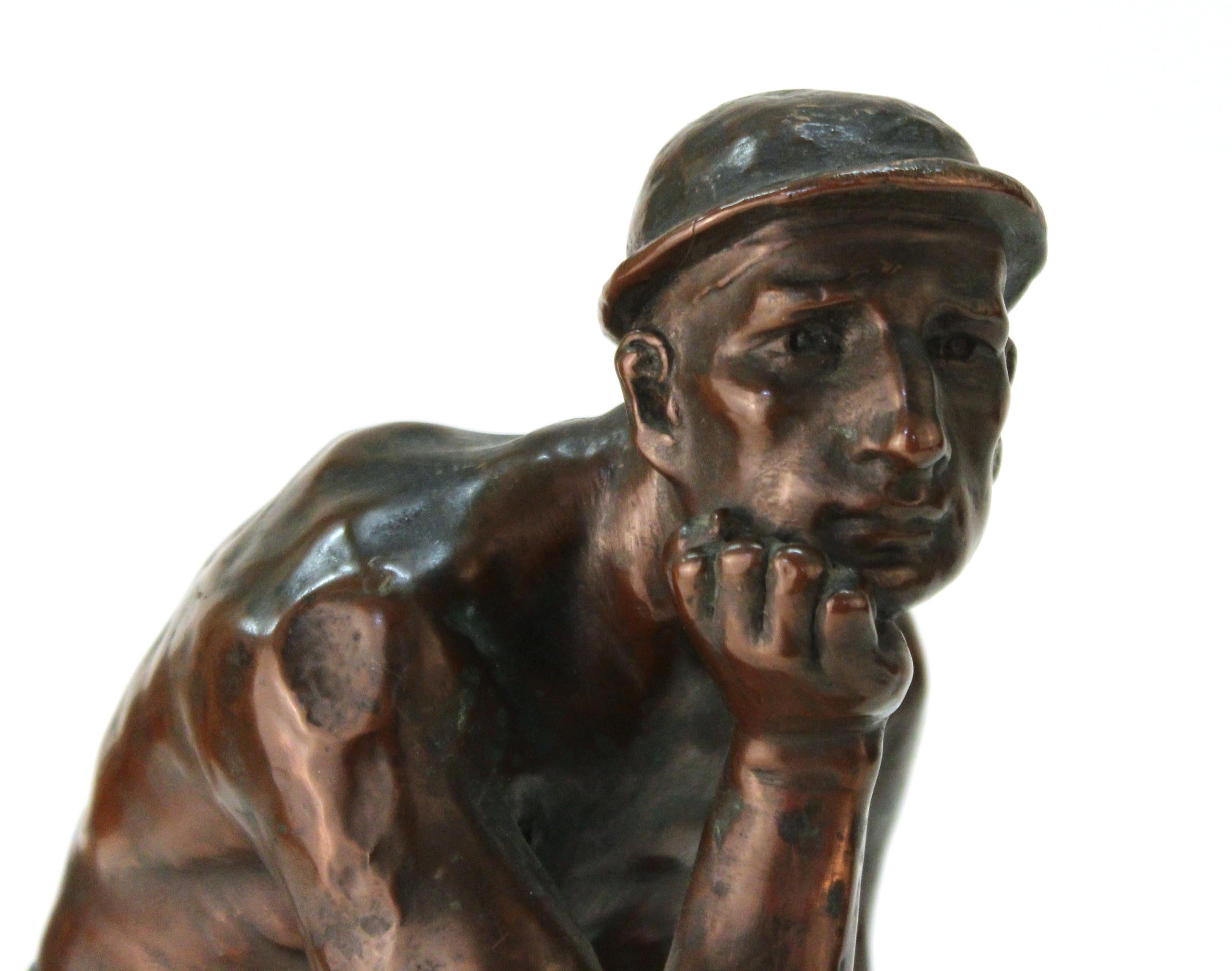 Art Deco period European sculpture of an industry worker, illegibly signed. The piece is made of copper clad metal and is in great antique condition with age-appropriate wear.