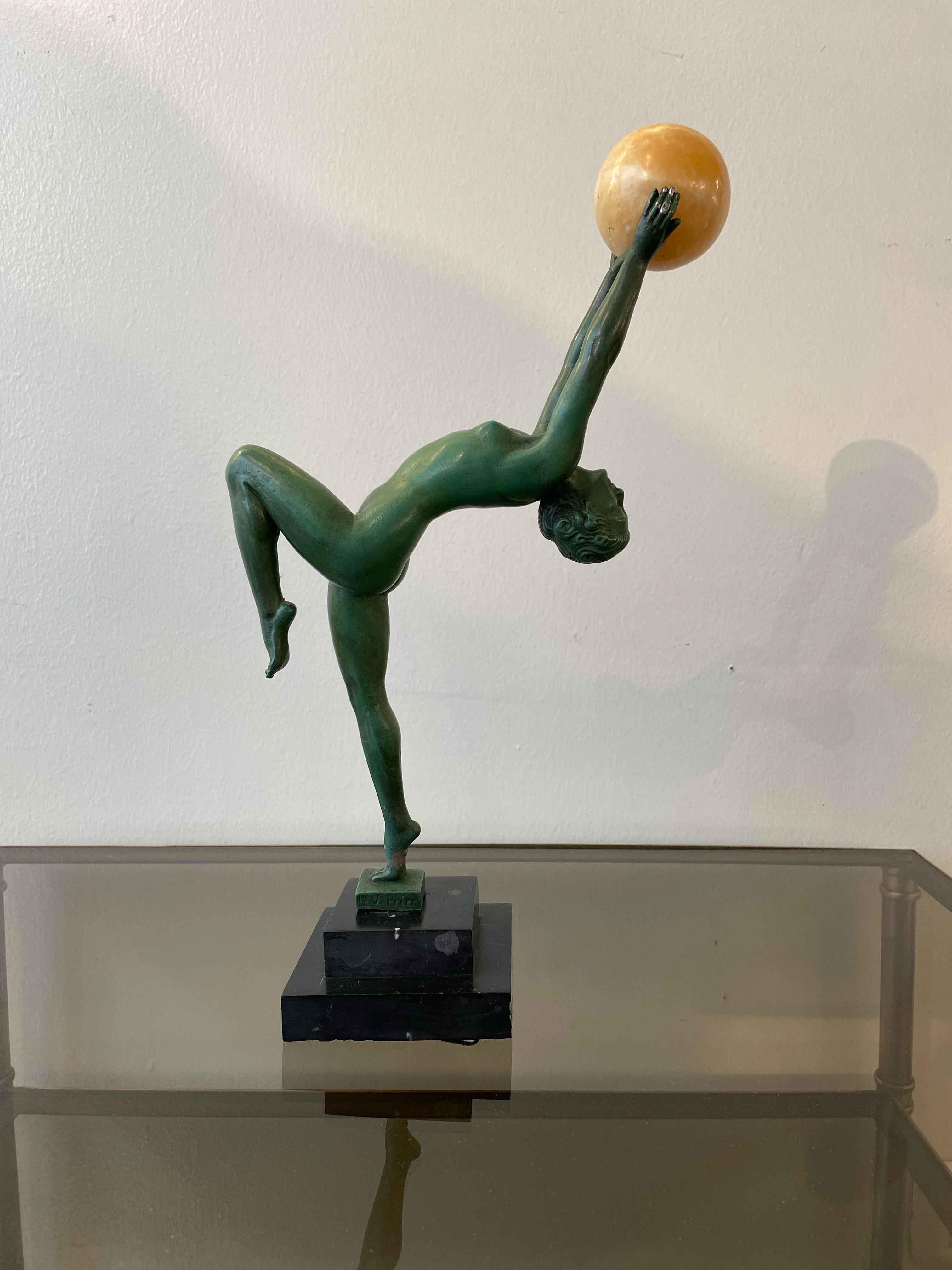 Art Deco sculpture of Juggler in patinated bronze by Le Verrier. 
The statue features a woman with very elegant and delicate movements. Max Le Verrier was known for being a pioneer within the Parisian Art Deco movement, creating decorative art