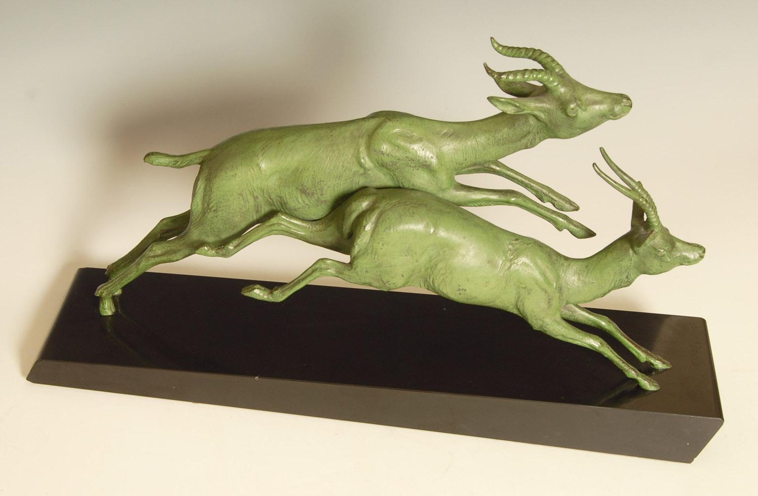 Large French Art Deco sculpture of leaping antelope by Theodore Plagnet.
Patinated metal on black marble base, signed Plagnet.

Price includes free shipping to anywhere in the world.